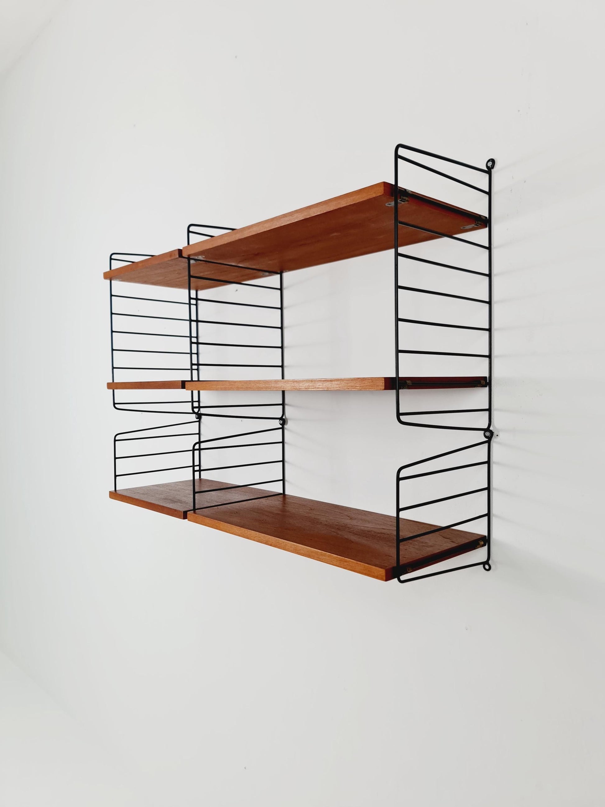 Original MCM Teak shelving system - consists of Black lacquered metal ladders, from string Stockholm 1960s