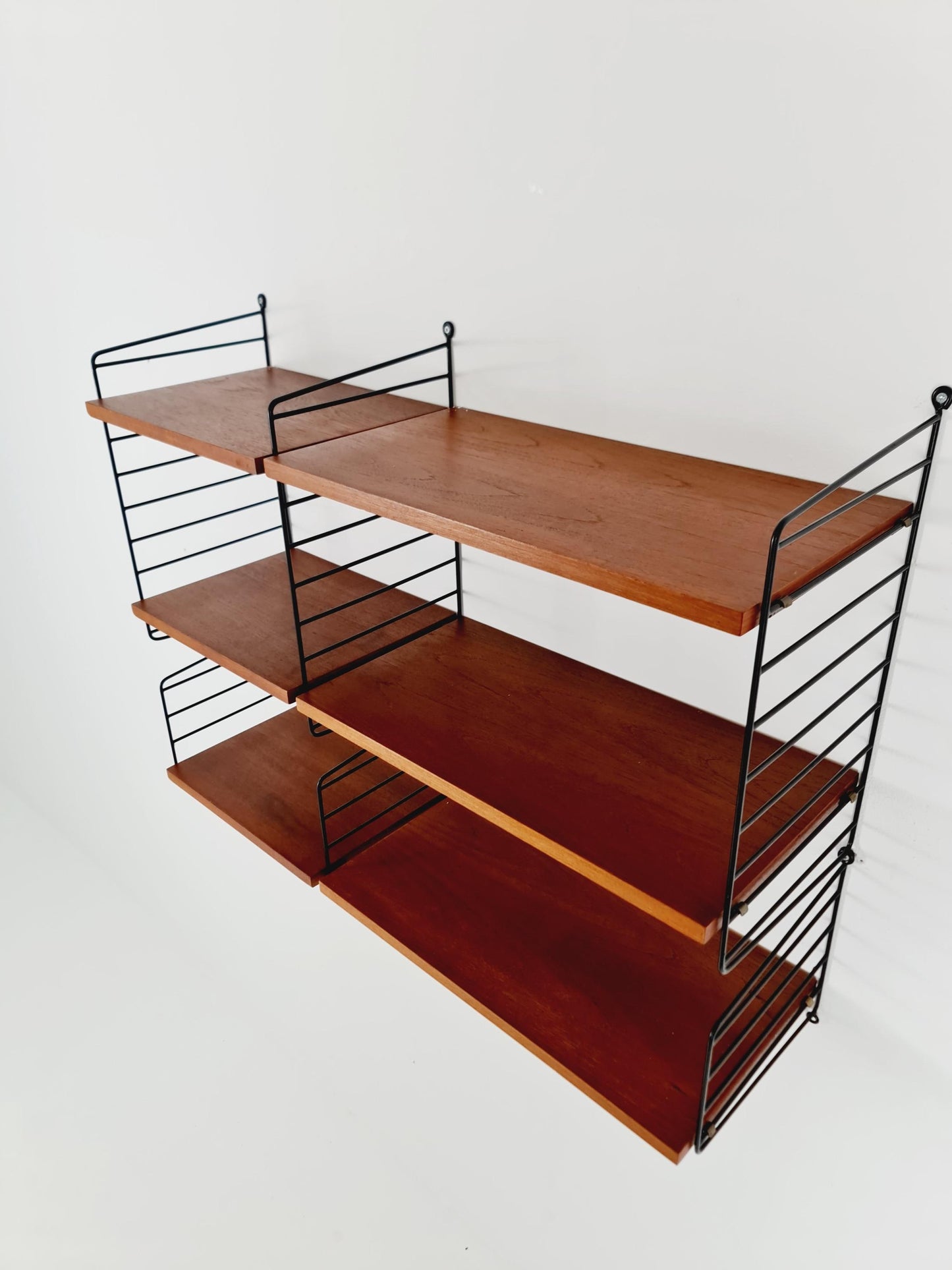 Original MCM Teak shelving system - consists of Black lacquered metal ladders, from string Stockholm 1960s