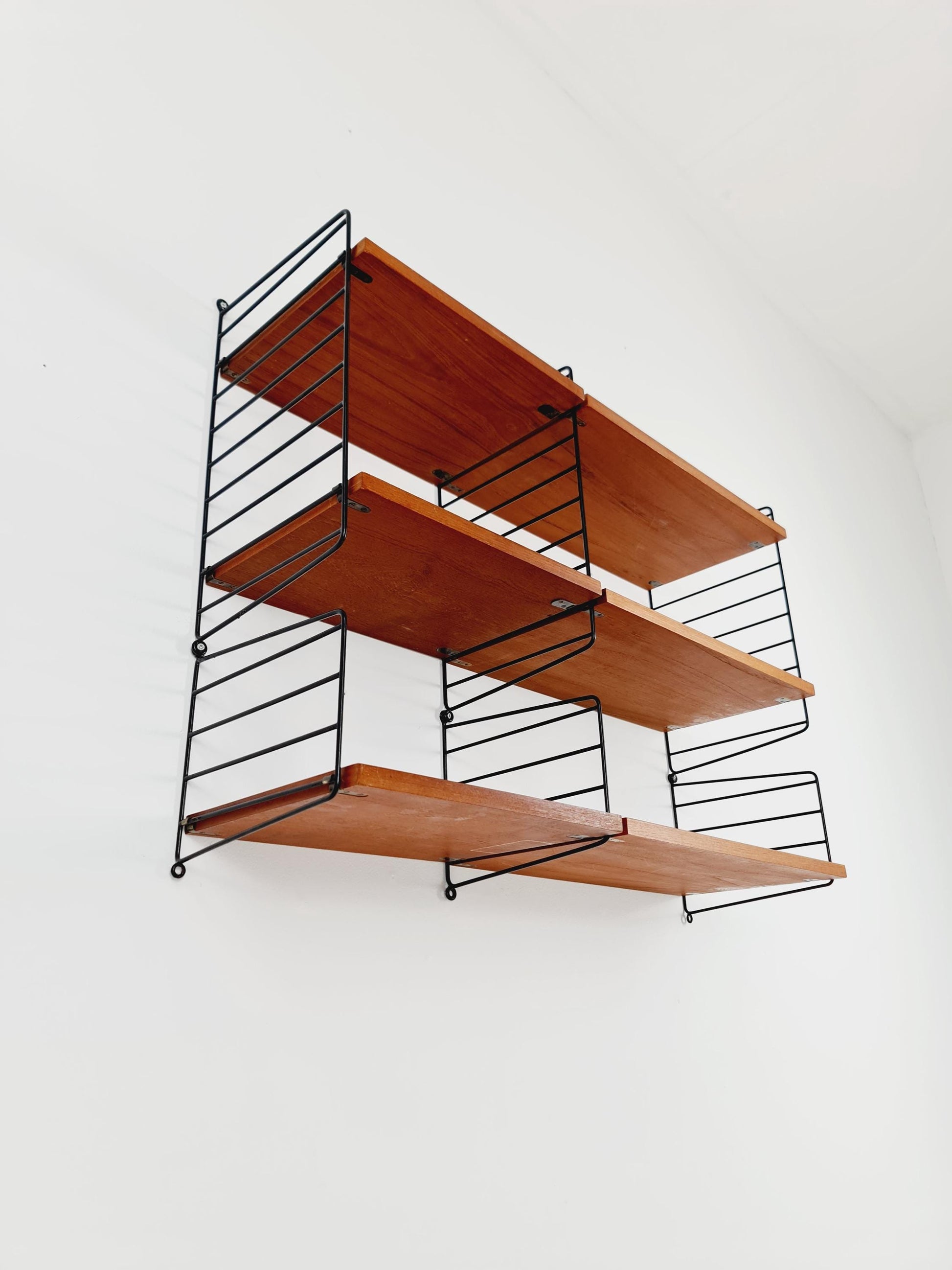 Original MCM Teak shelving system - consists of Black lacquered metal ladders, from string Stockholm 1960s