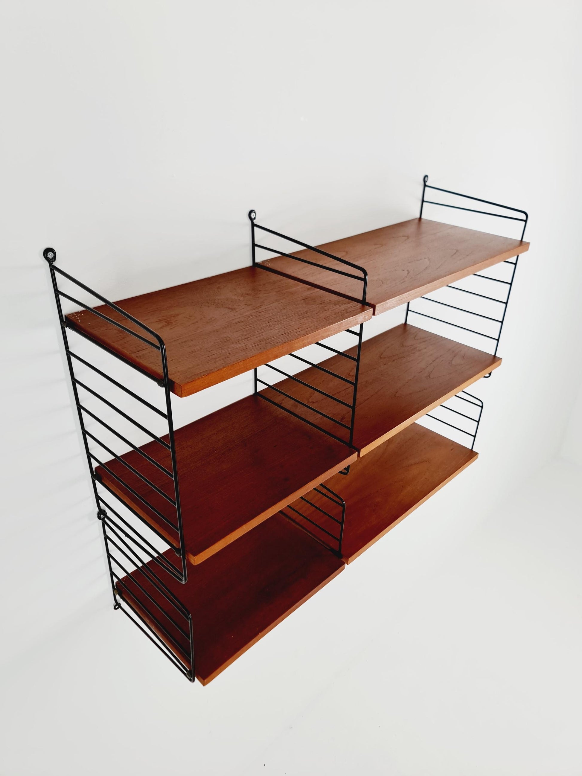 Original MCM Teak shelving system - consists of Black lacquered metal ladders, from string Stockholm 1960s