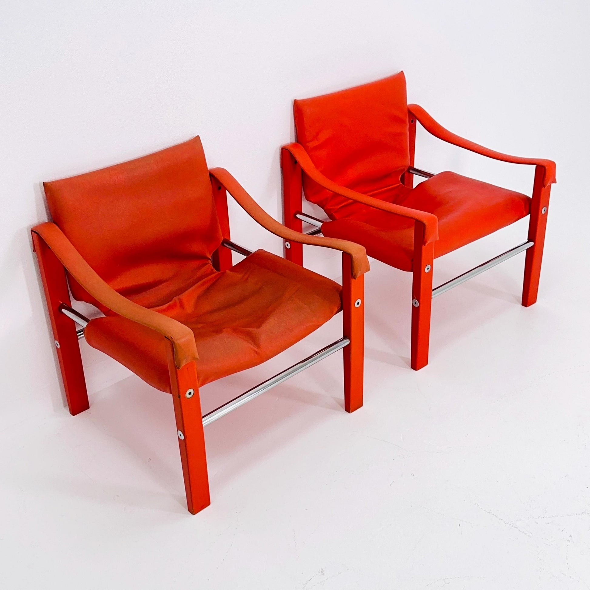 Set of 2 Mid century Red leather Safari armchairs from Arkana by Maurice Burke, United Kingdom 1970s Scotland