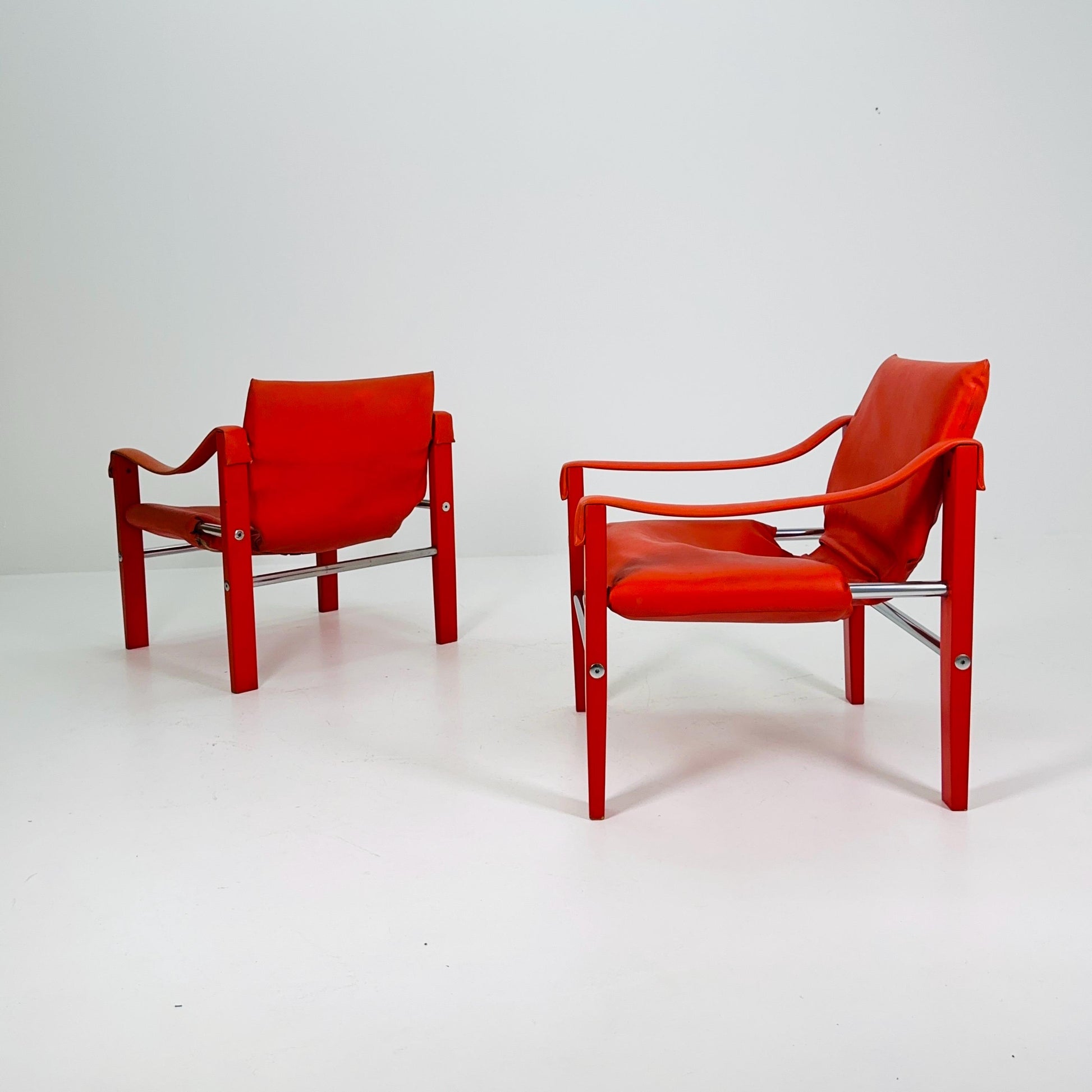Set of 2 Mid century Red leather Safari armchairs from Arkana by Maurice Burke, United Kingdom 1970s Scotland