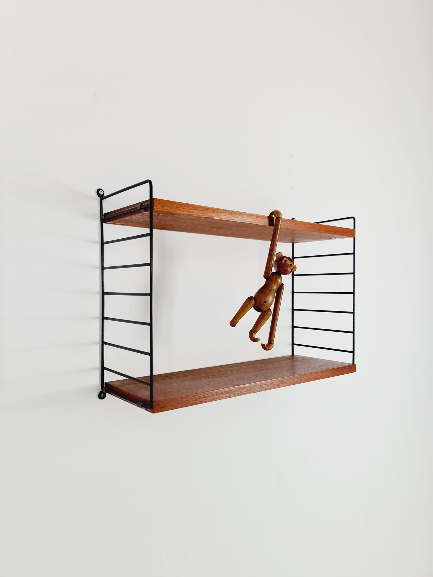 Original MCM Teak shelving system - consists of black lacquered metal ladders, from string Stockholm 1960s