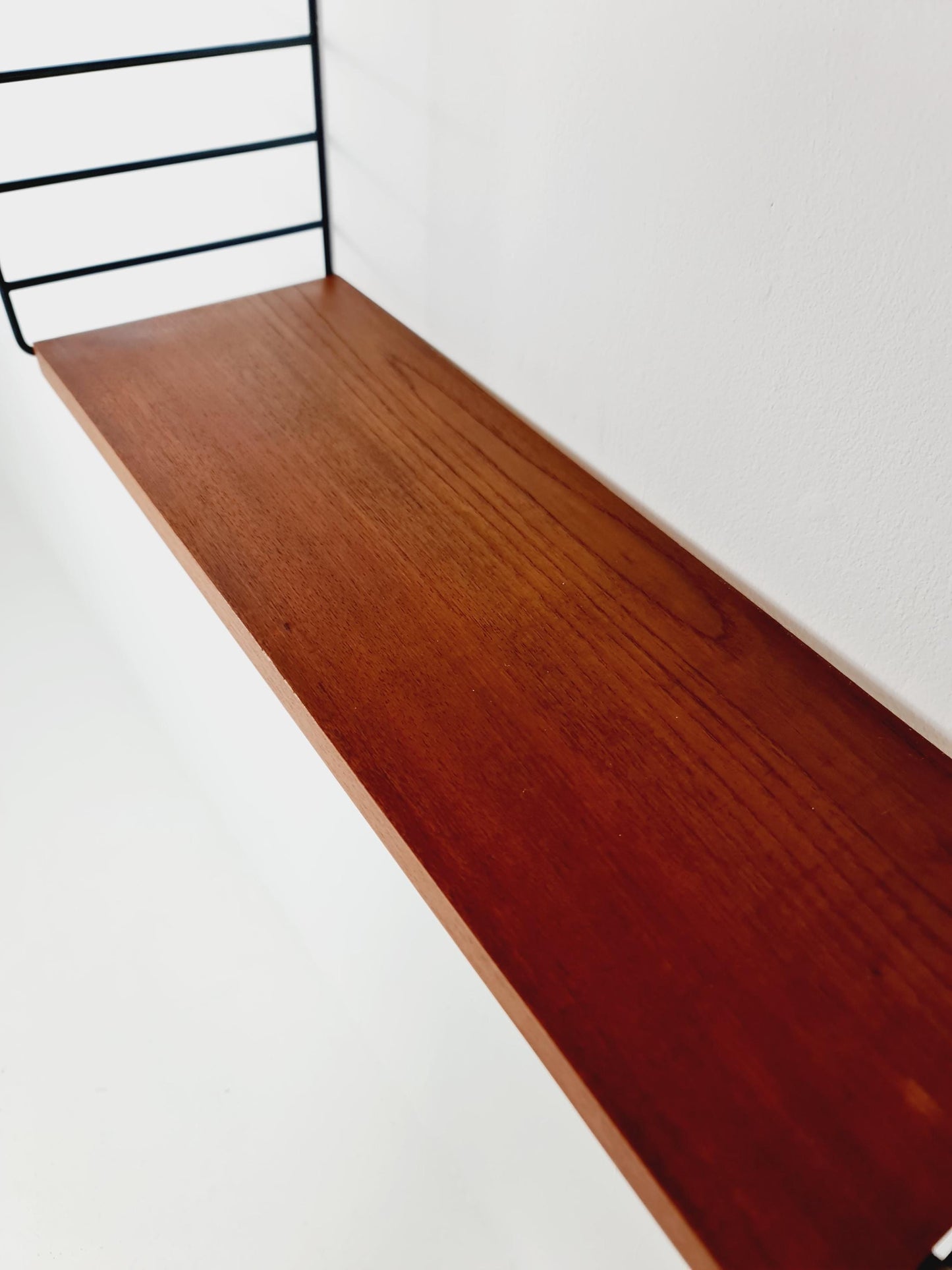 Original MCM Teak shelving system - consists of black lacquered metal ladders, from string Stockholm 1960s