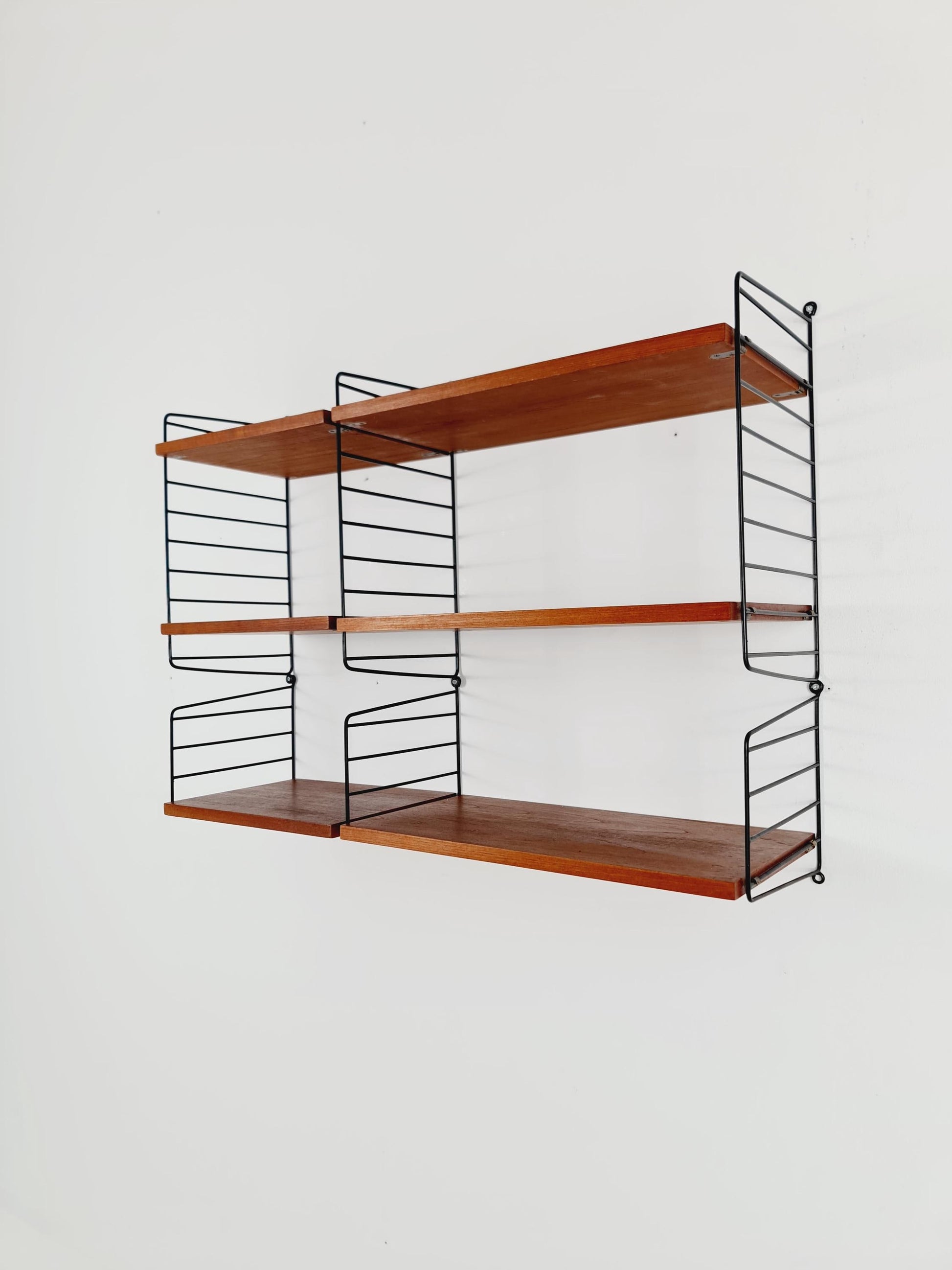 Original MCM Teak shelving system - consists of Black lacquered metal ladders, from string Stockholm 1960s