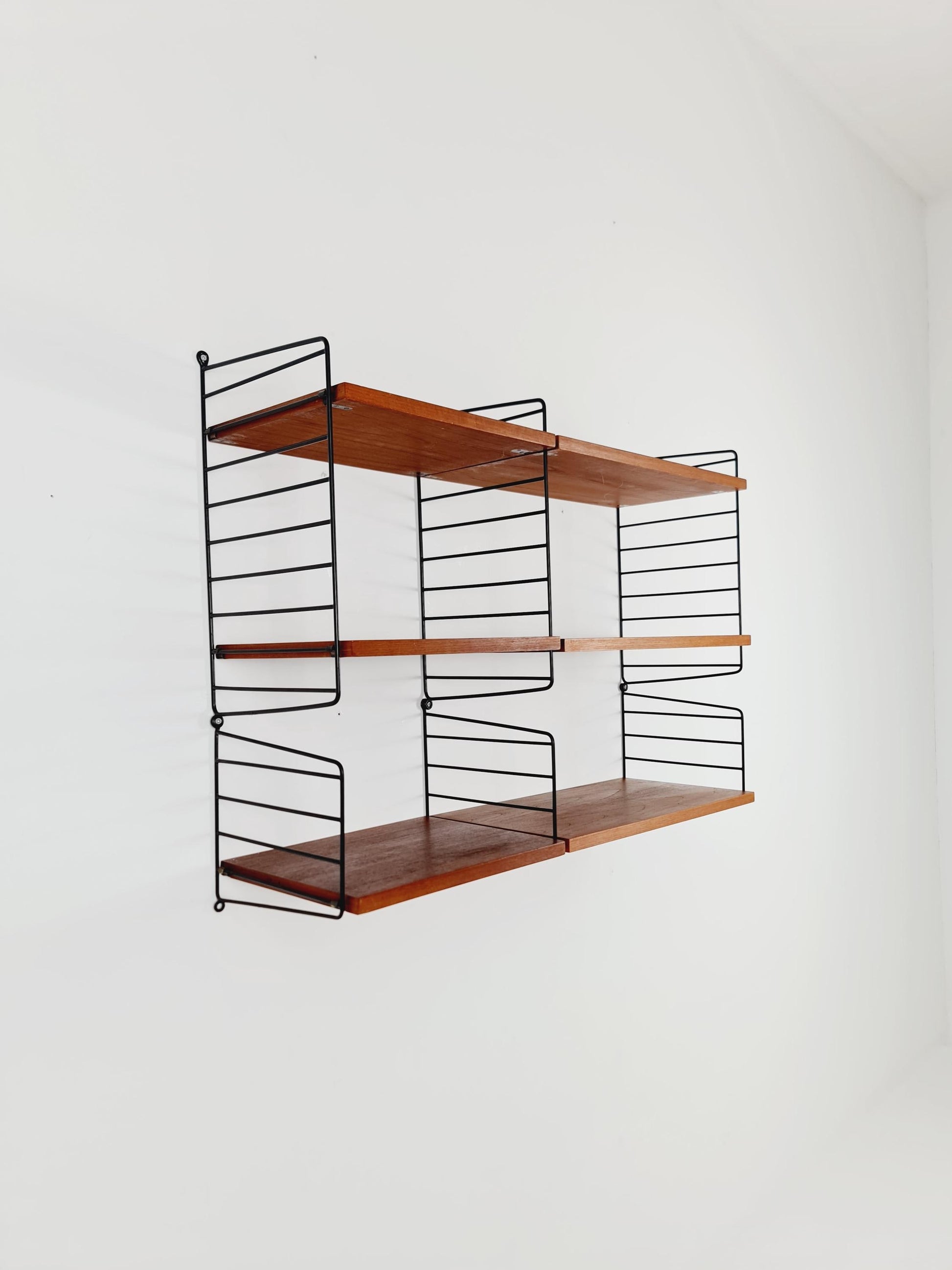 Original MCM Teak shelving system - consists of Black lacquered metal ladders, from string Stockholm 1960s