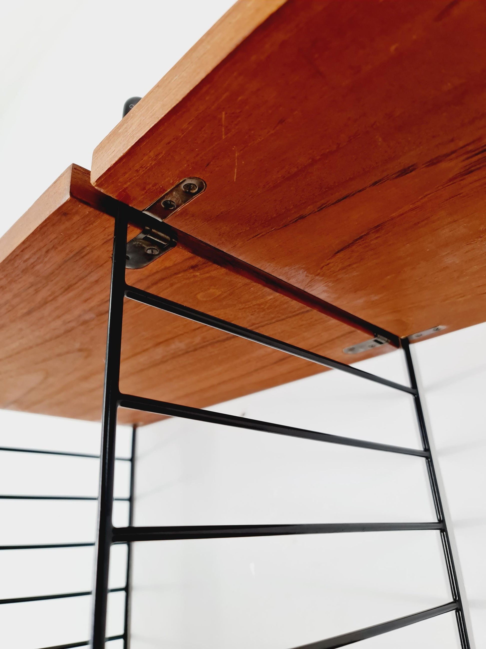 Original MCM Teak shelving system - consists of Black lacquered metal ladders, from string Stockholm 1960s