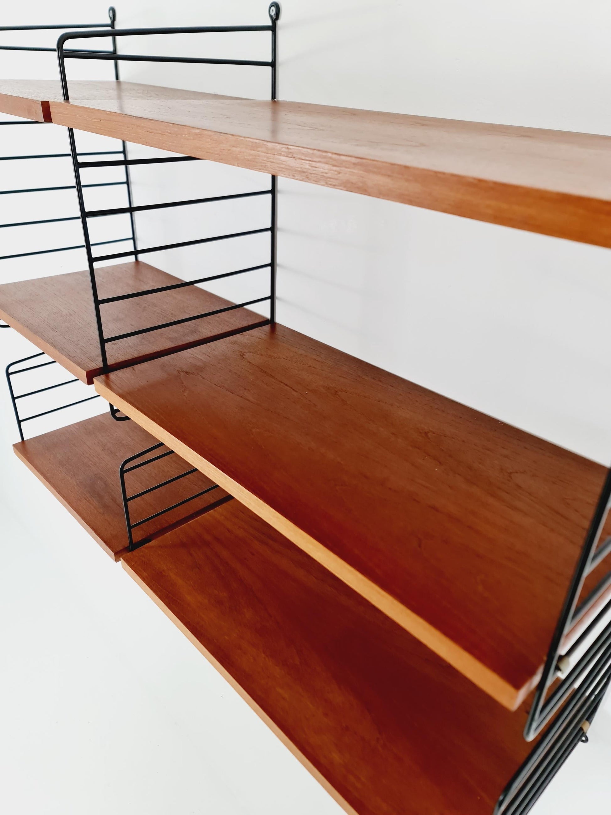 Original MCM Teak shelving system - consists of Black lacquered metal ladders, from string Stockholm 1960s