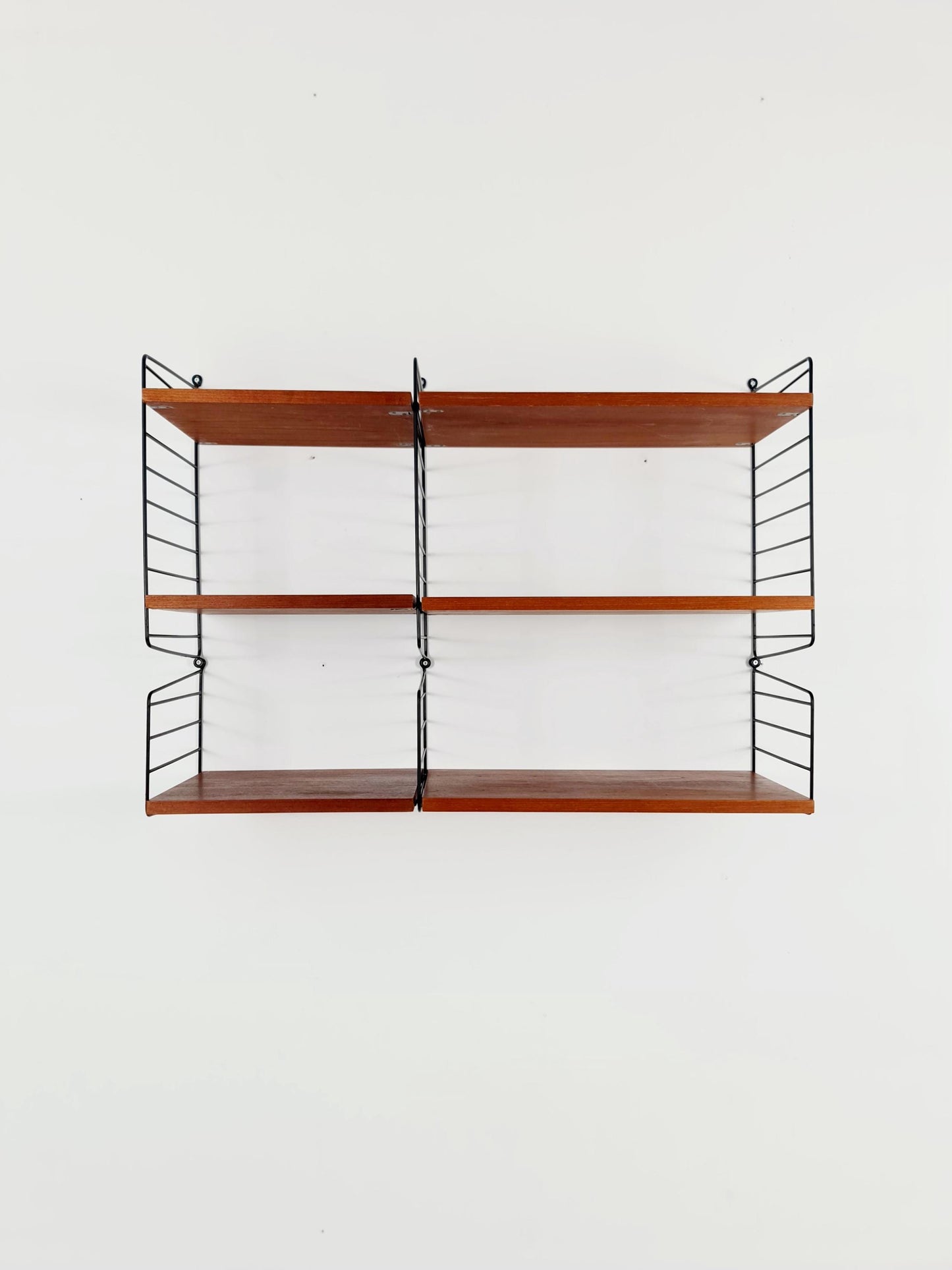 Original MCM Teak shelving system - consists of Black lacquered metal ladders, from string Stockholm 1960s