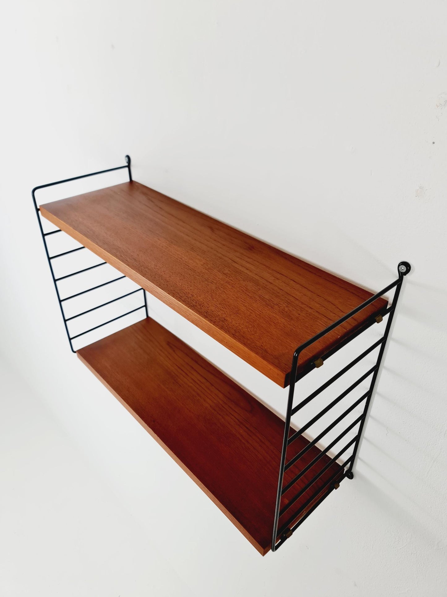 Original MCM Teak shelving system - consists of black lacquered metal ladders, from string Stockholm 1960s