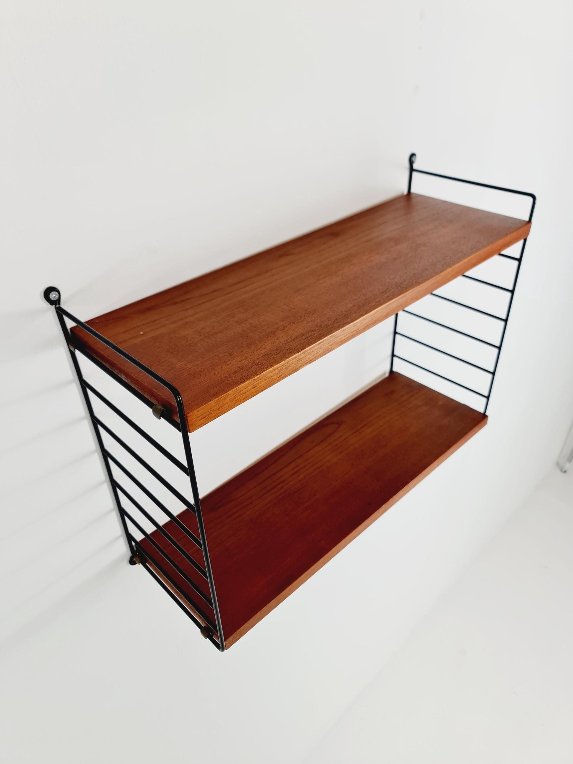 Original MCM Teak shelving system - consists of black lacquered metal ladders, from string Stockholm 1960s