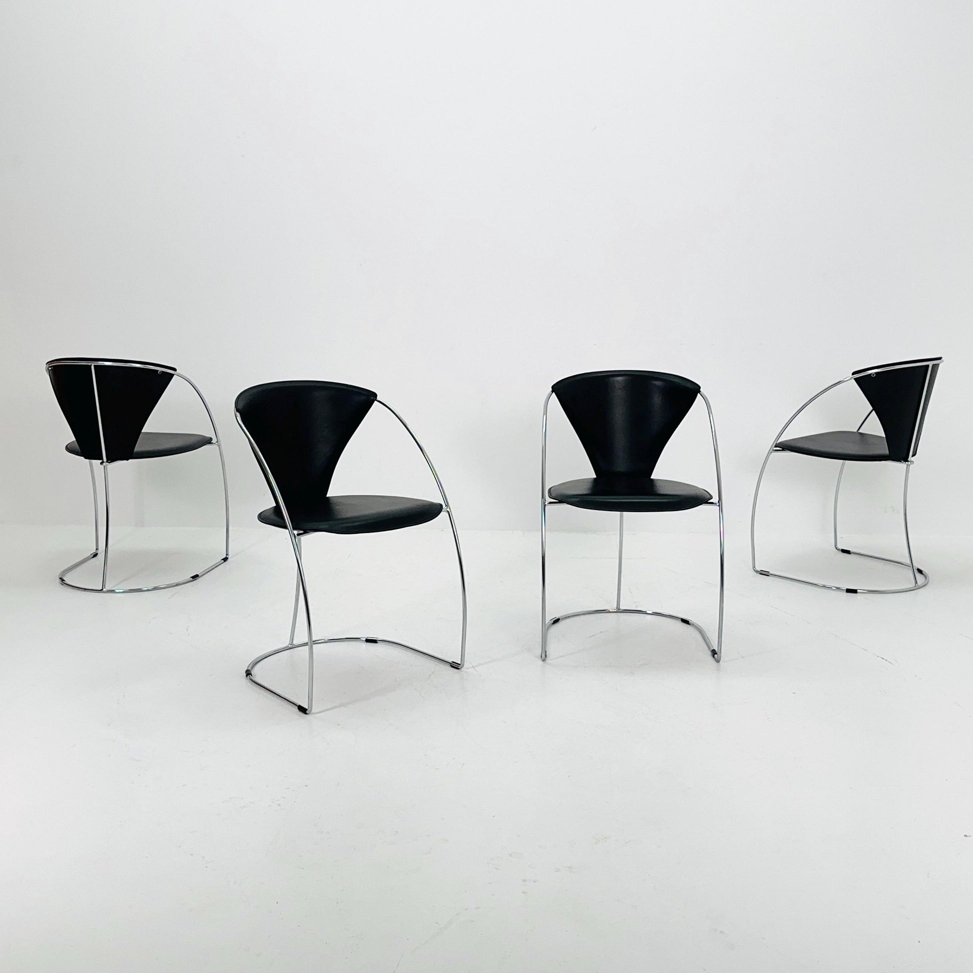 Set of 4 Mid-Century Modern Dining Armchairs by Arrben | Model Linda, Black Leather & Chrome, Italy 1980s