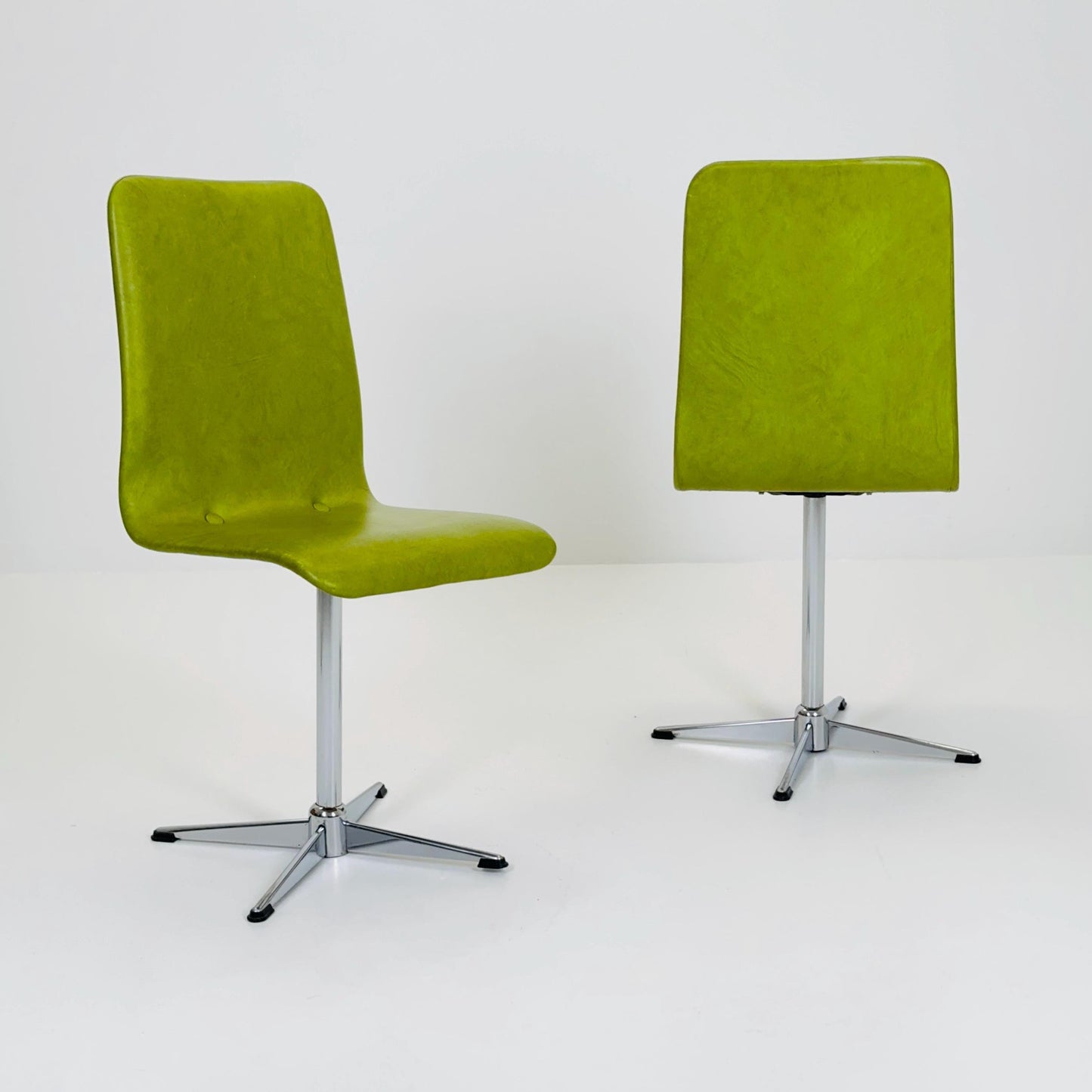 1 of 2 Bauhaus Mid-Century Lounge Swivel Chair — Chrome Base & Green faux leather — Germany, 1980s