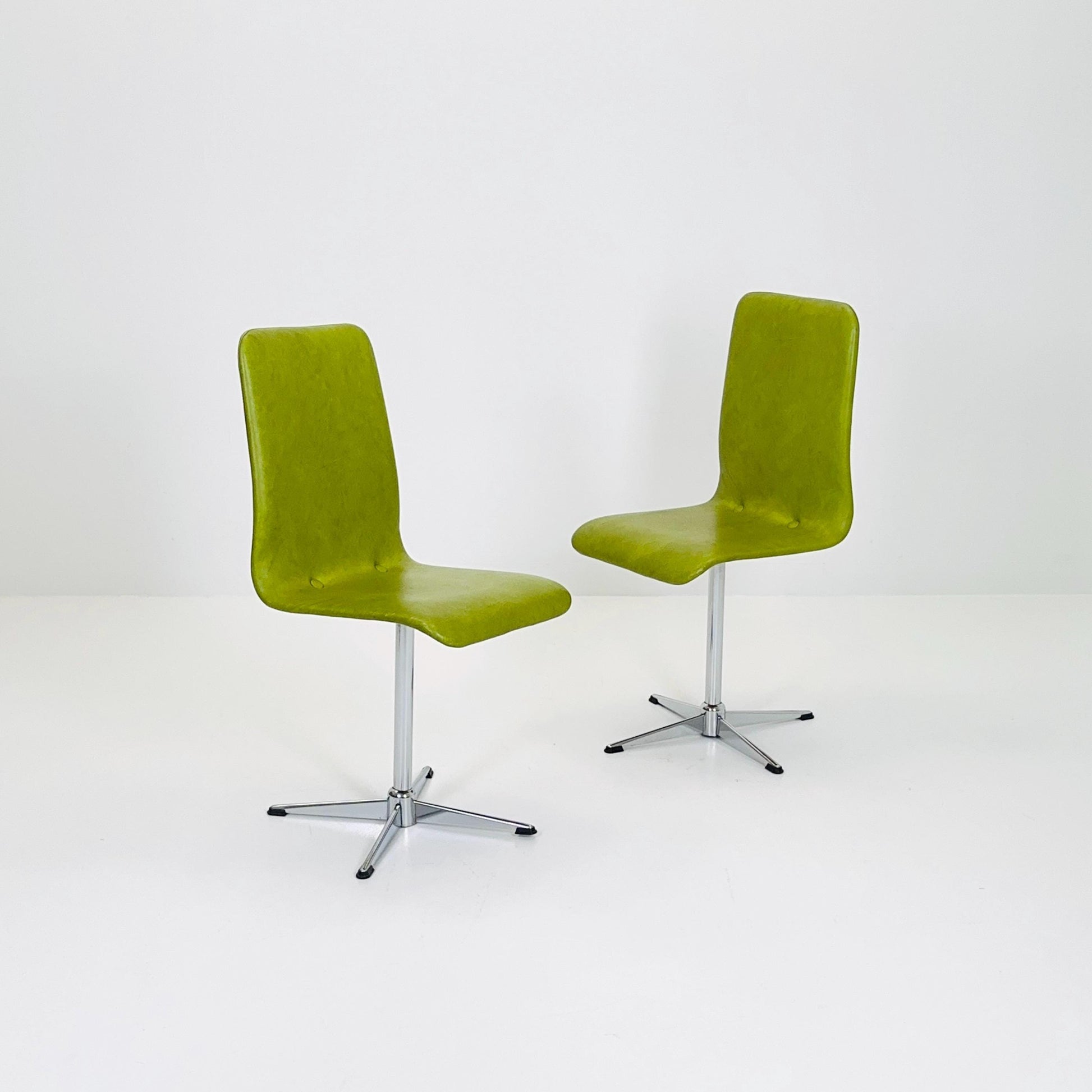 1 of 2 Bauhaus Mid-Century Lounge Swivel Chair — Chrome Base & Green faux leather — Germany, 1980s