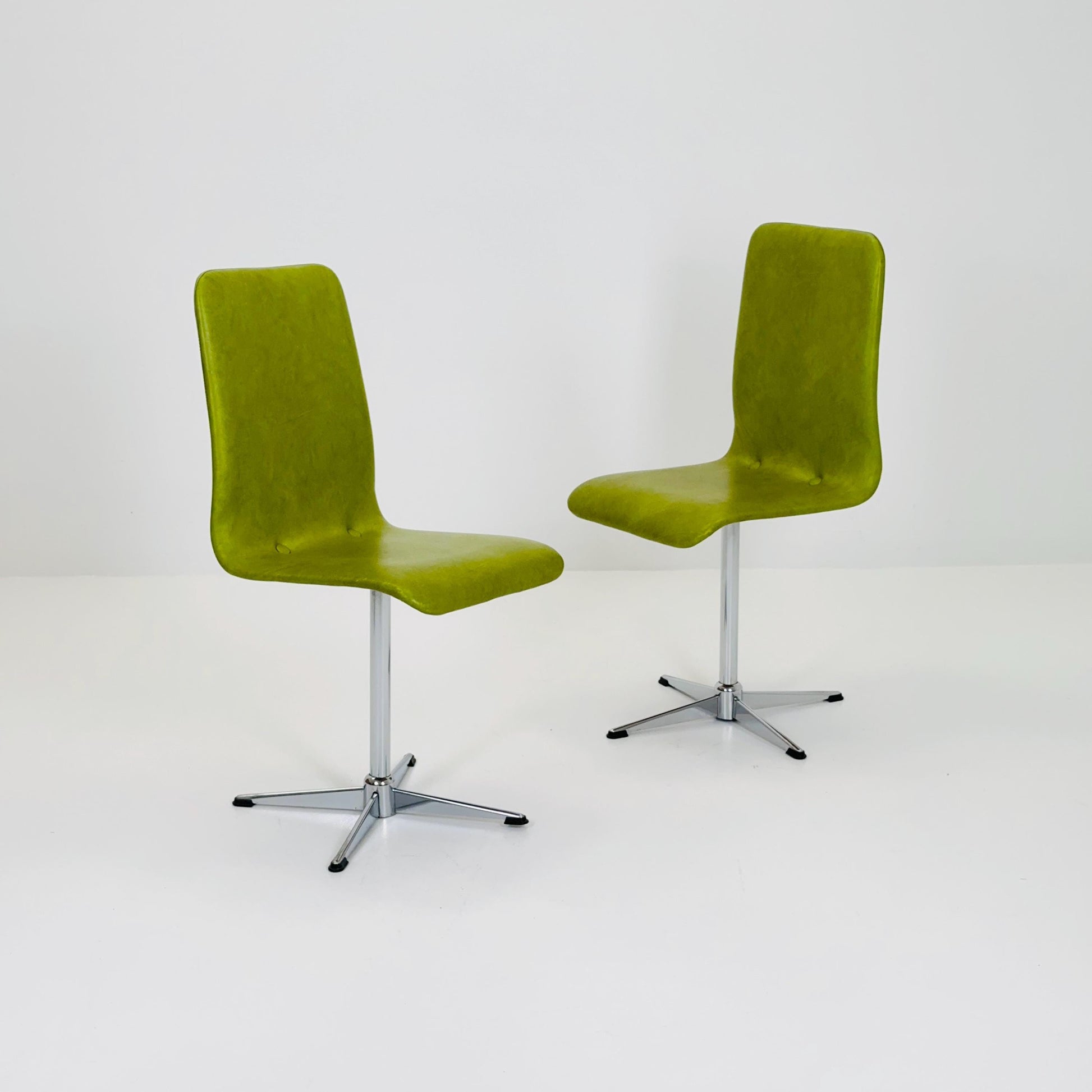 1 of 2 Bauhaus Mid-Century Lounge Swivel Chair — Chrome Base & Green faux leather — Germany, 1980s