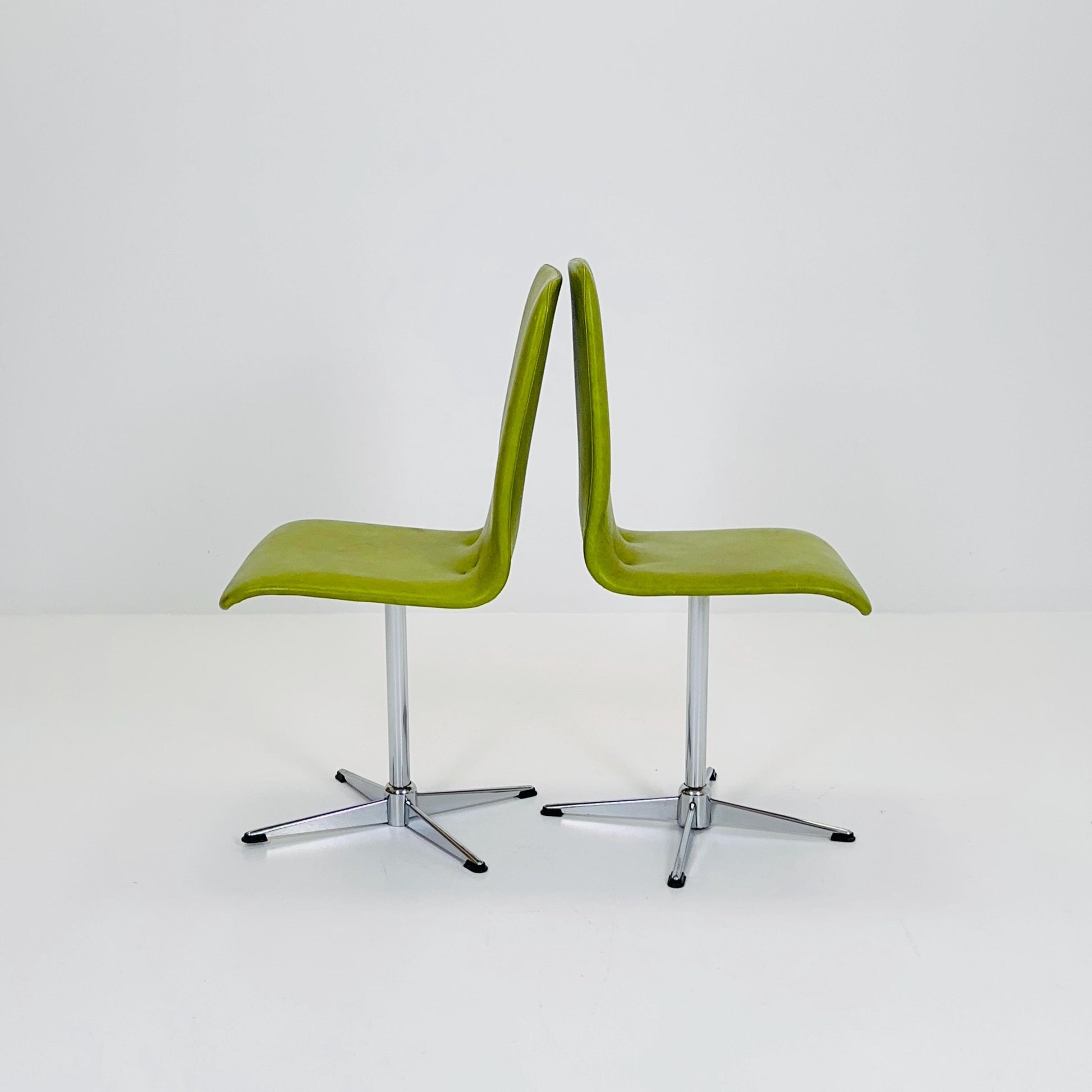 1 of 2 Bauhaus Mid-Century Lounge Swivel Chair — Chrome Base & Green faux leather — Germany, 1980s