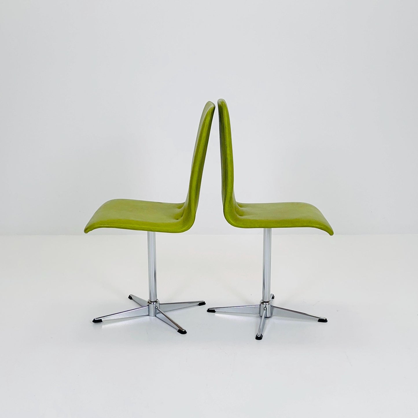 1 of 2 Bauhaus Mid-Century Lounge Swivel Chair — Chrome Base & Green faux leather — Germany, 1980s