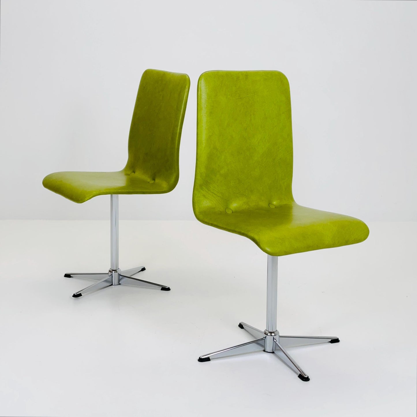 1 of 2 Bauhaus Mid-Century Lounge Swivel Chair — Chrome Base & Green faux leather — Germany, 1980s