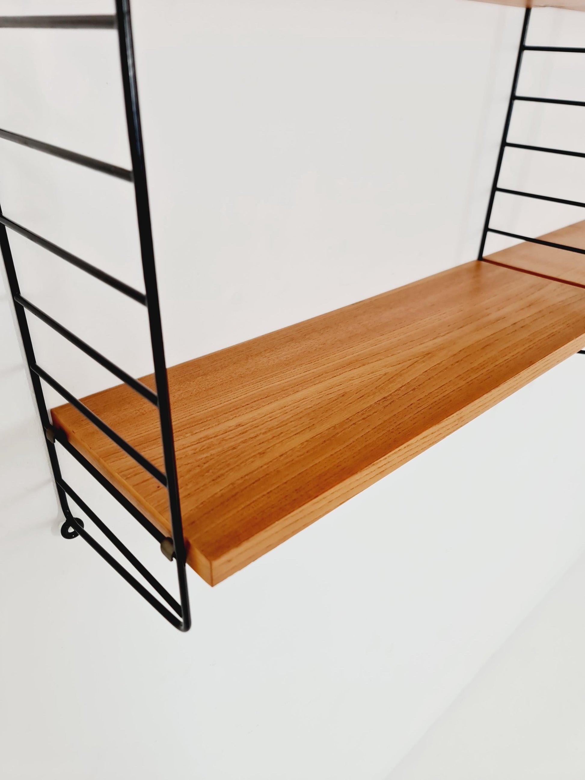 Original MCM Ash shelving system - consists of Black lacquered metal ladders, from string Stockholm 1960s