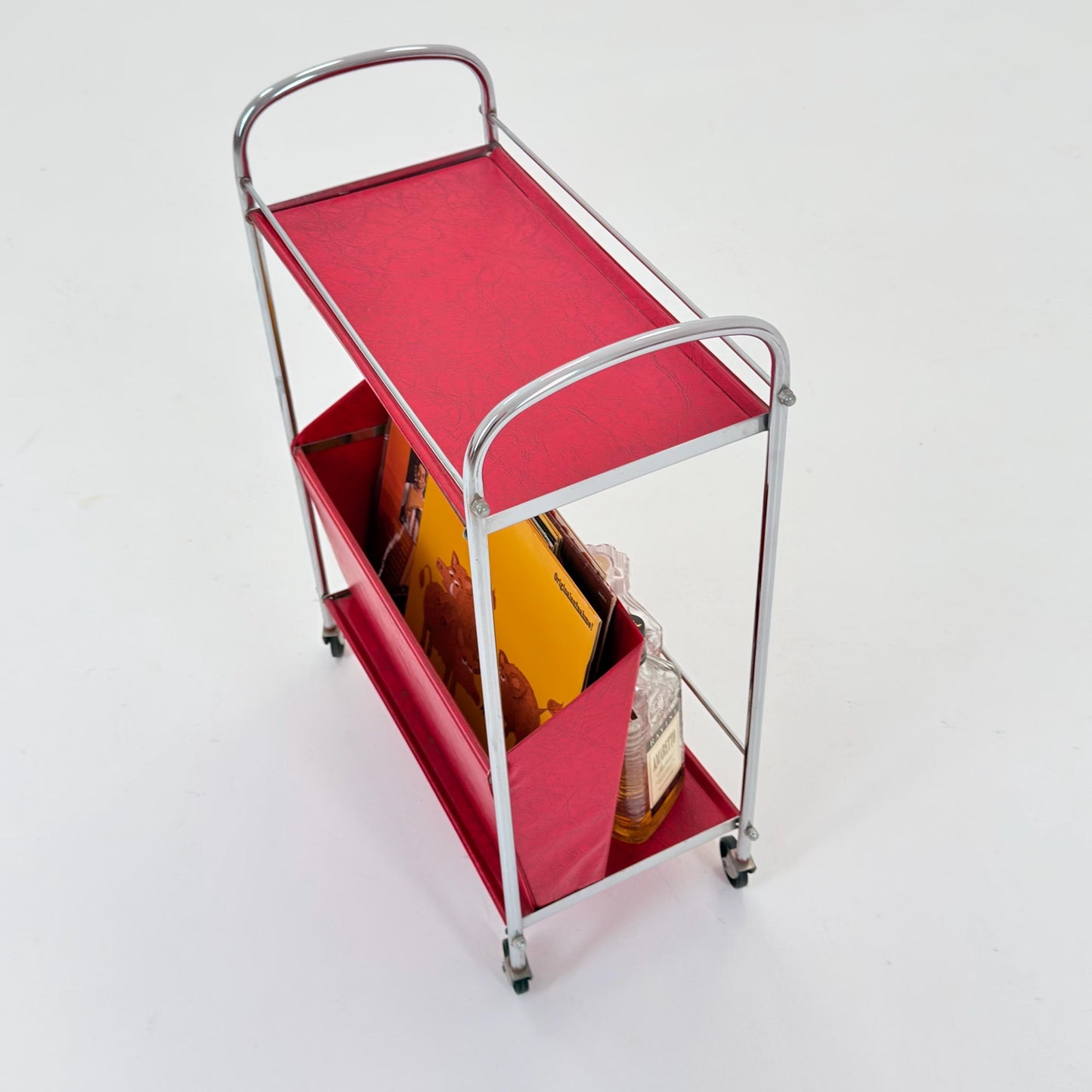 Mid century Bauhaus Rolling magazine holder - bar cart - side table chrome and red vinyl -1980s Germany