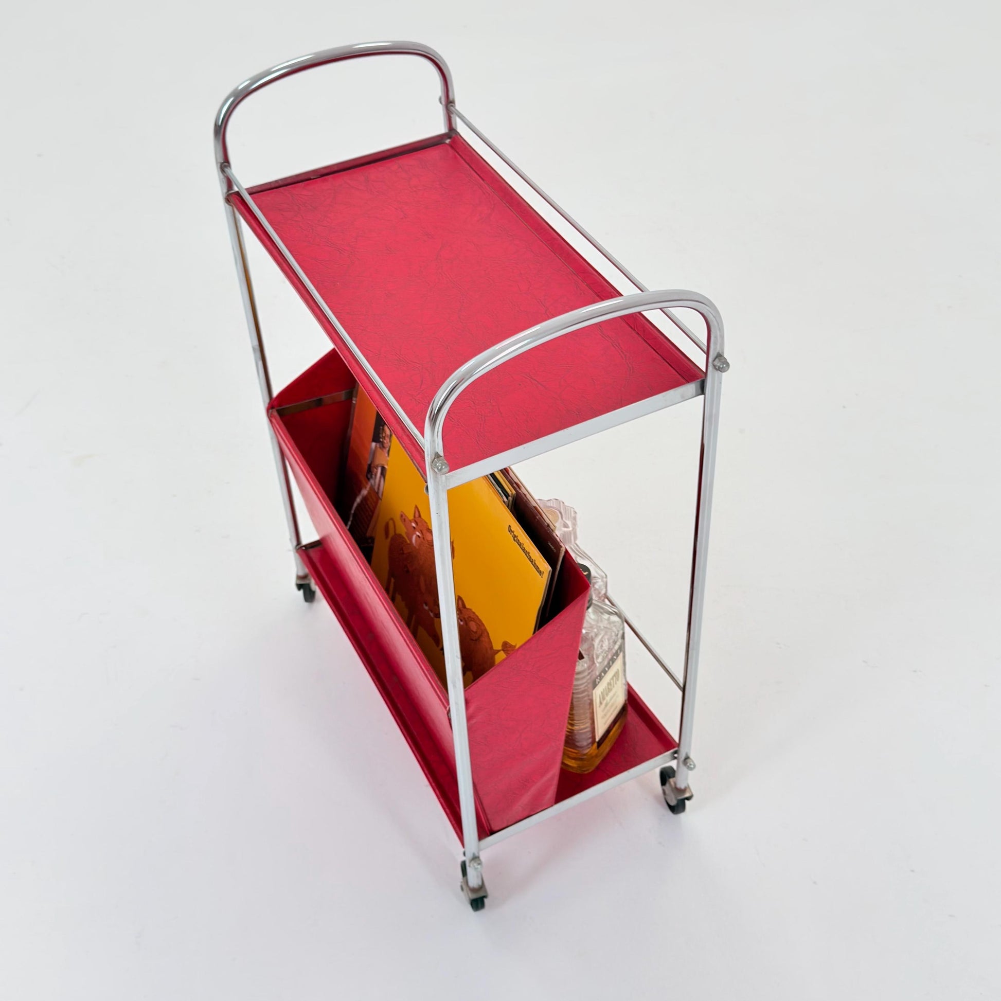 Mid century Bauhaus Rolling magazine holder - bar cart - side table chrome and red vinyl -1980s Germany