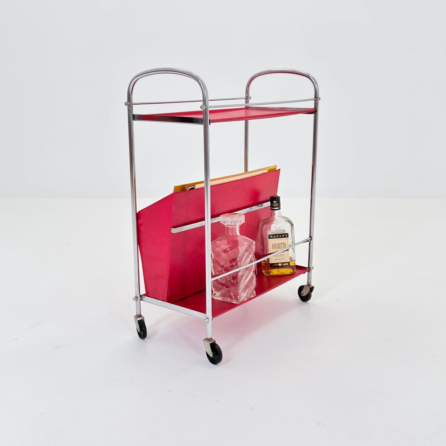 Mid century Bauhaus Rolling magazine holder - bar cart - side table chrome and red vinyl -1980s Germany