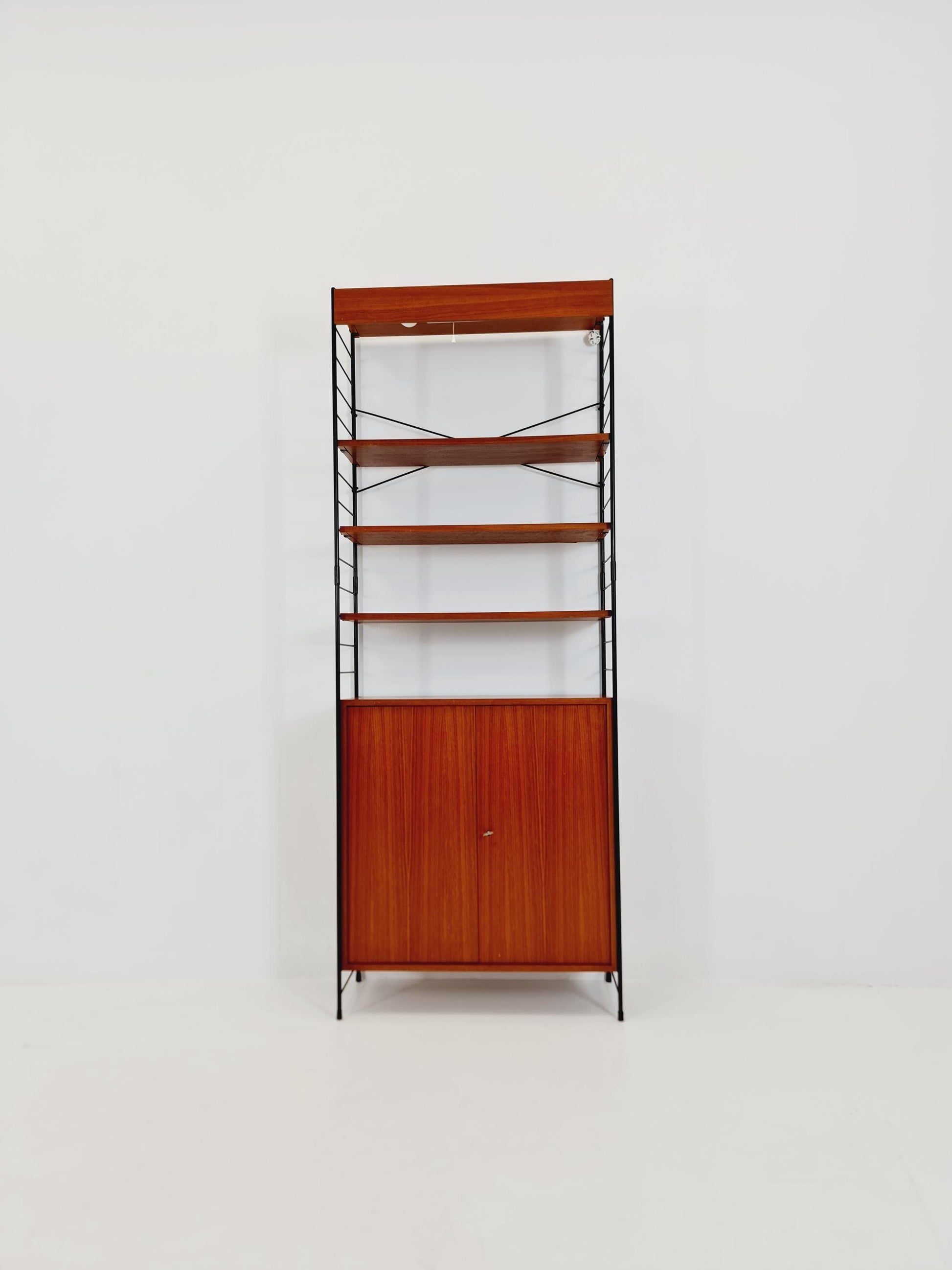 Free standing String shelf-system, bookcase with cabinet and lighting teak by WHB Germany, 1950s