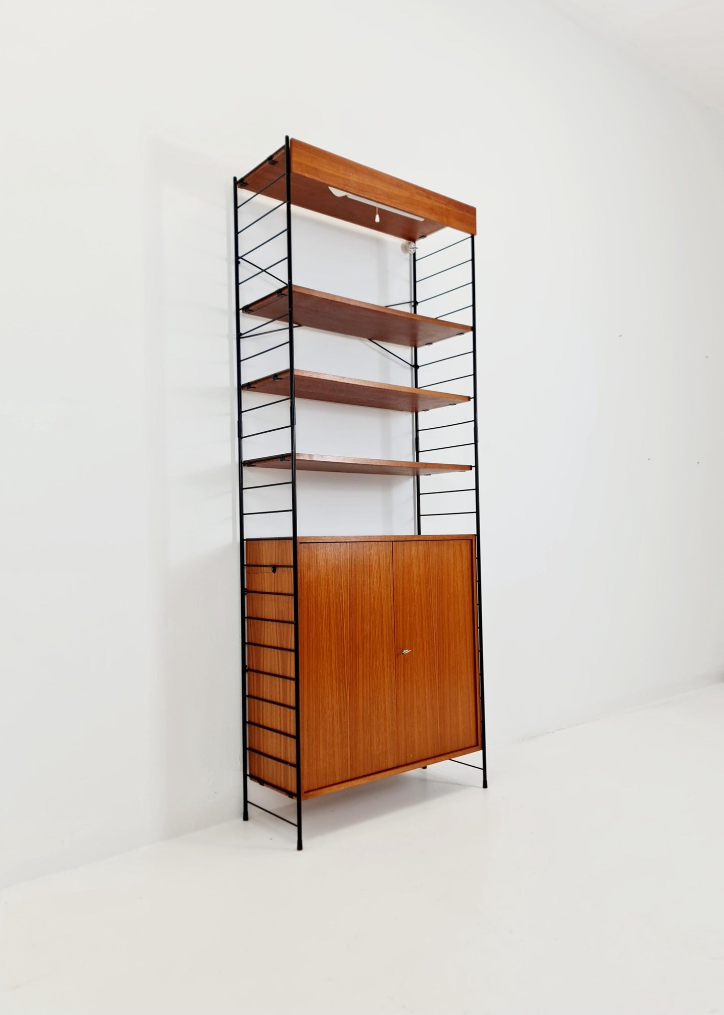 Free standing String shelf-system, bookcase with cabinet and lighting teak by WHB Germany, 1950s
