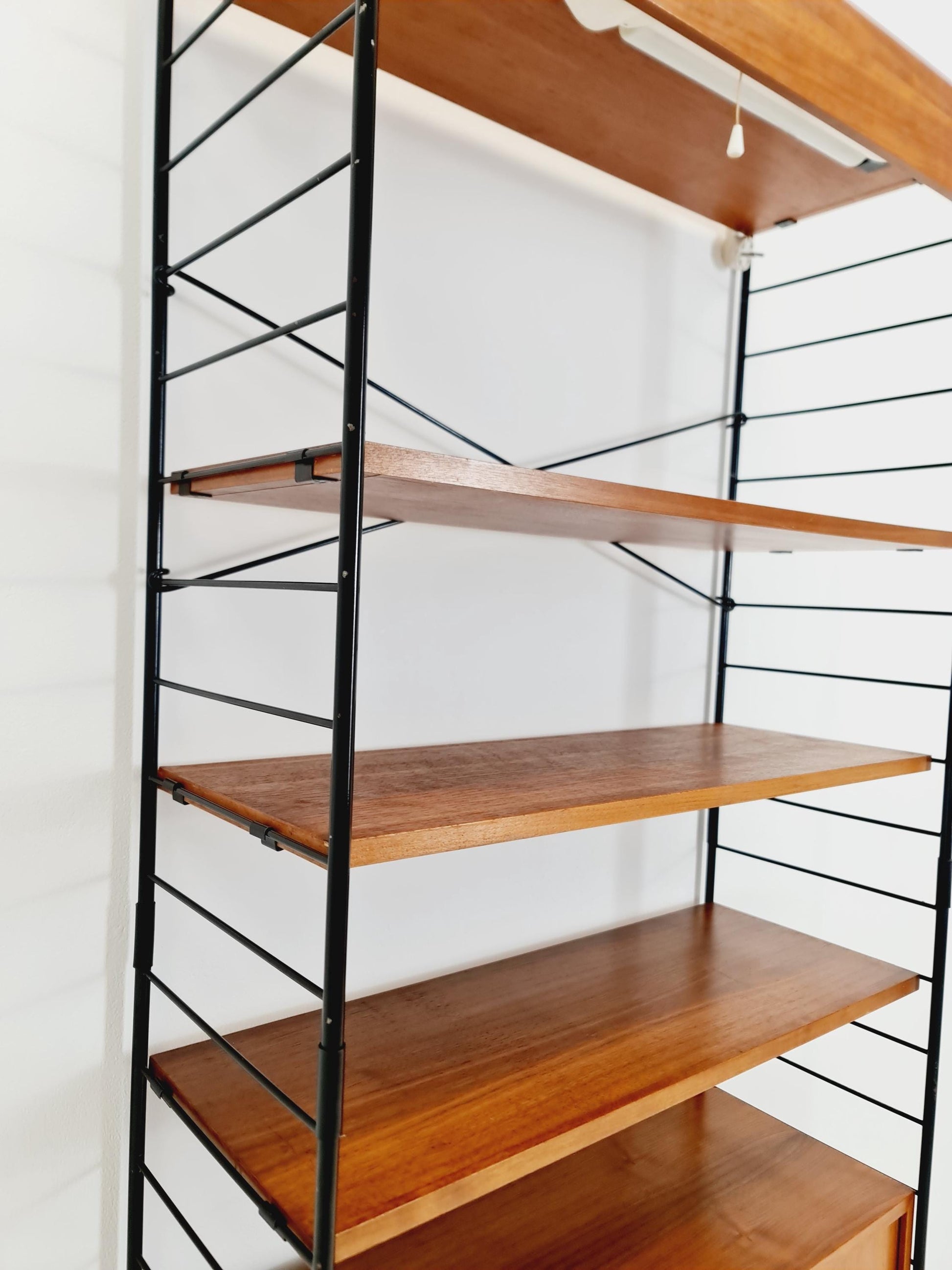 Free standing String shelf-system, bookcase with cabinet and lighting teak by WHB Germany, 1950s