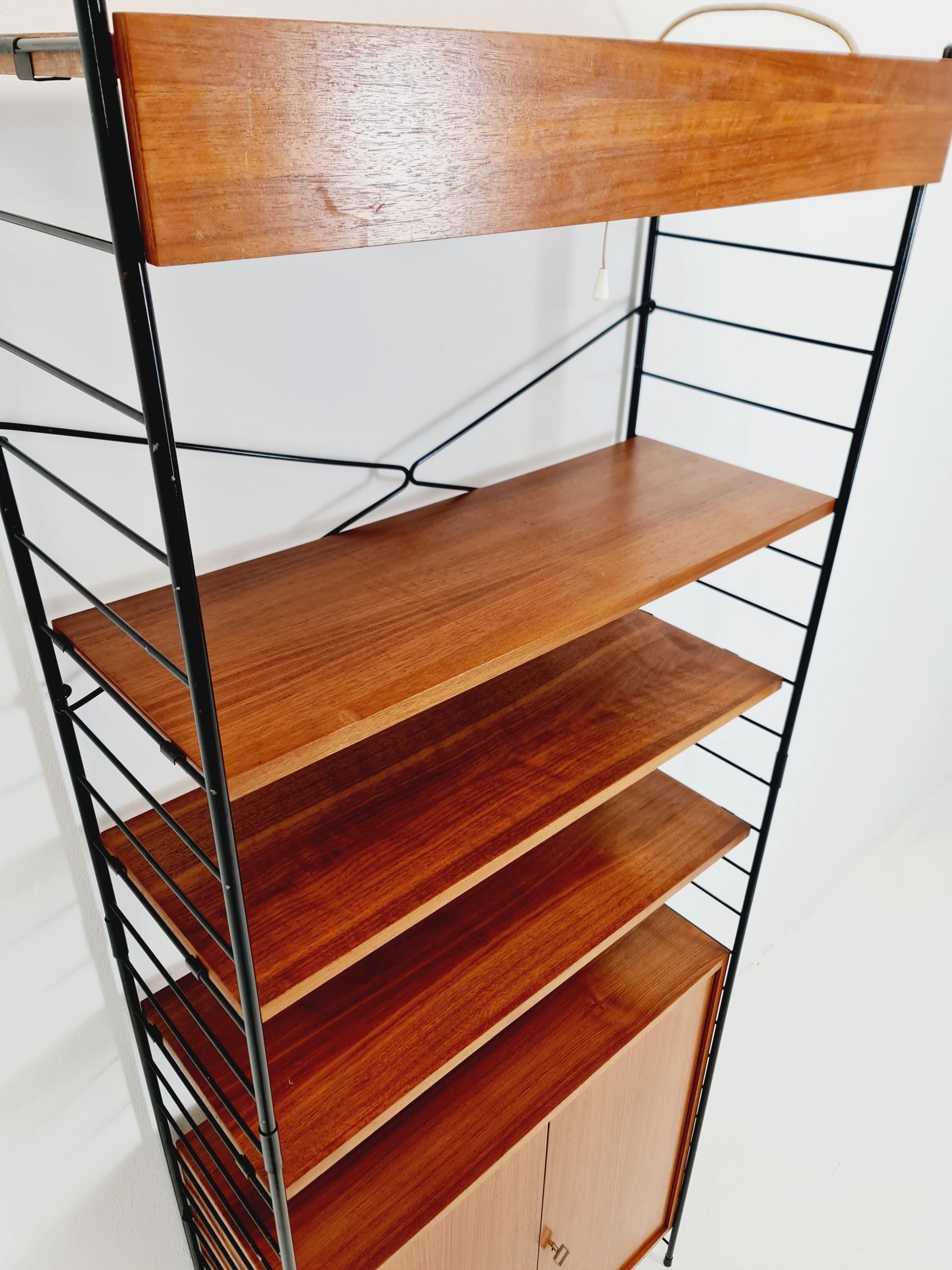 Free standing String shelf-system, bookcase with cabinet and lighting teak by WHB Germany, 1950s
