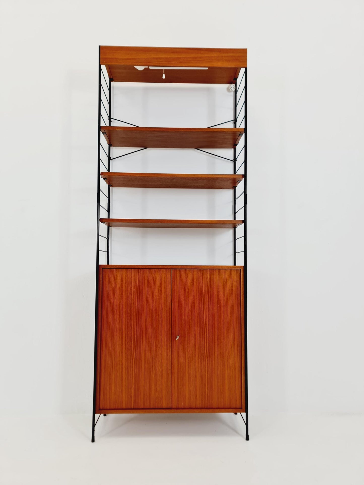 Free standing String shelf-system, bookcase with cabinet and lighting teak by WHB Germany, 1950s