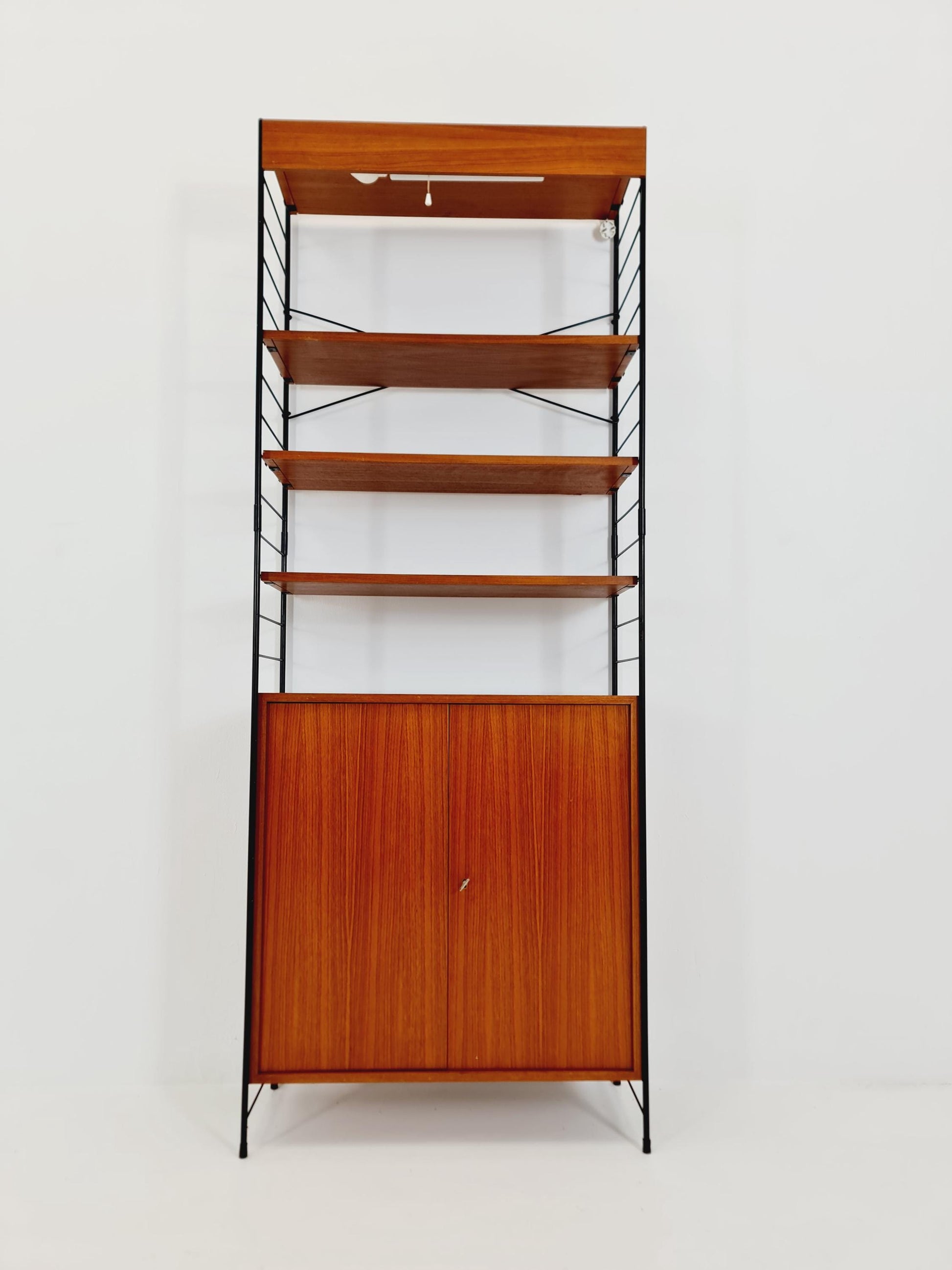 Free standing String shelf-system, bookcase with cabinet and lighting teak by WHB Germany, 1950s