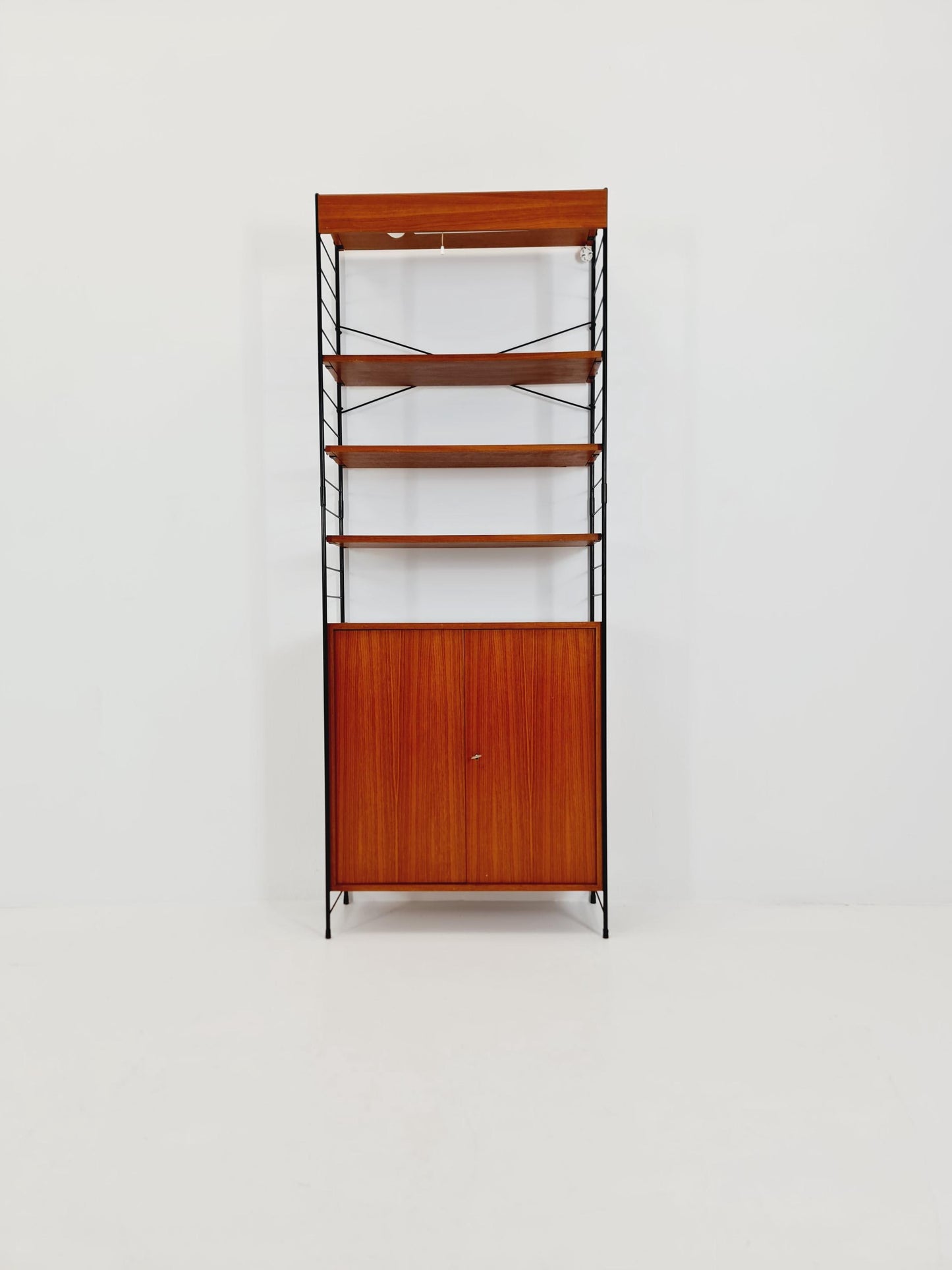 Free standing String shelf-system, bookcase with cabinet and lighting teak by WHB Germany, 1950s