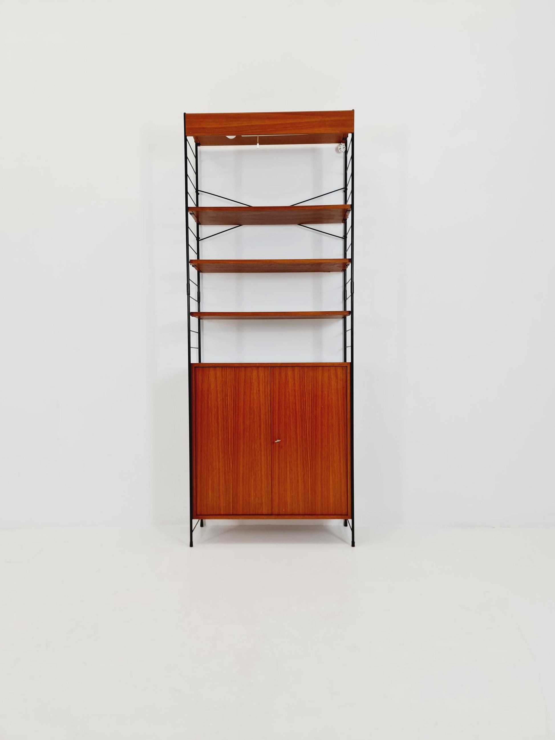 Free standing String shelf-system, bookcase with cabinet and lighting teak by WHB Germany, 1950s