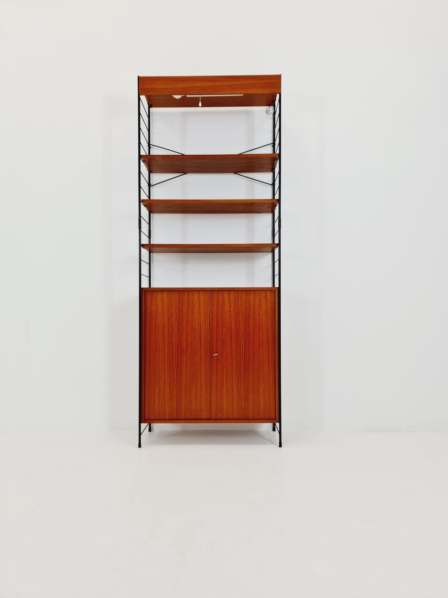 Free standing String shelf-system, bookcase with cabinet and lighting teak by WHB Germany, 1950s