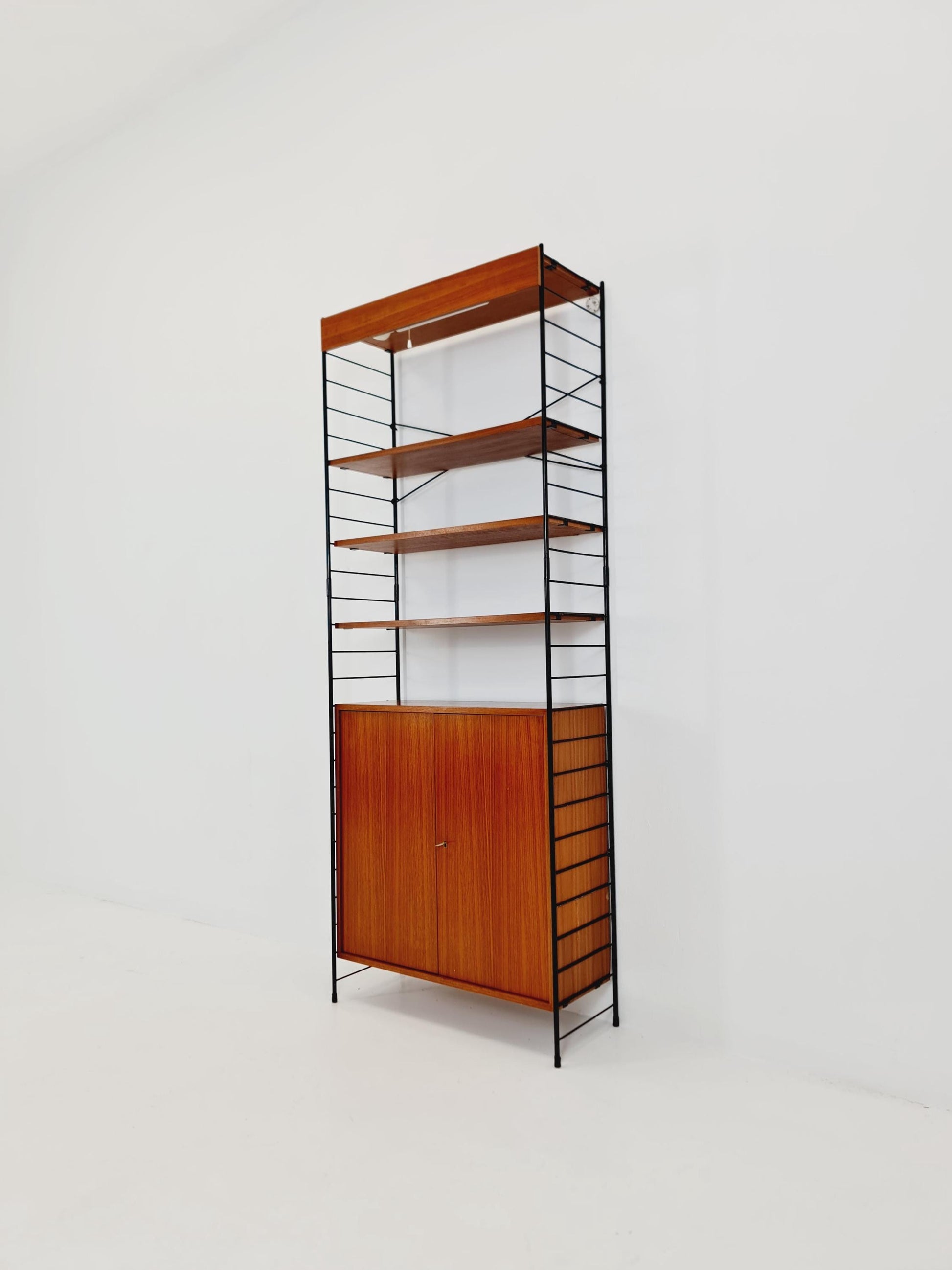 Free standing String shelf-system, bookcase with cabinet and lighting teak by WHB Germany, 1950s
