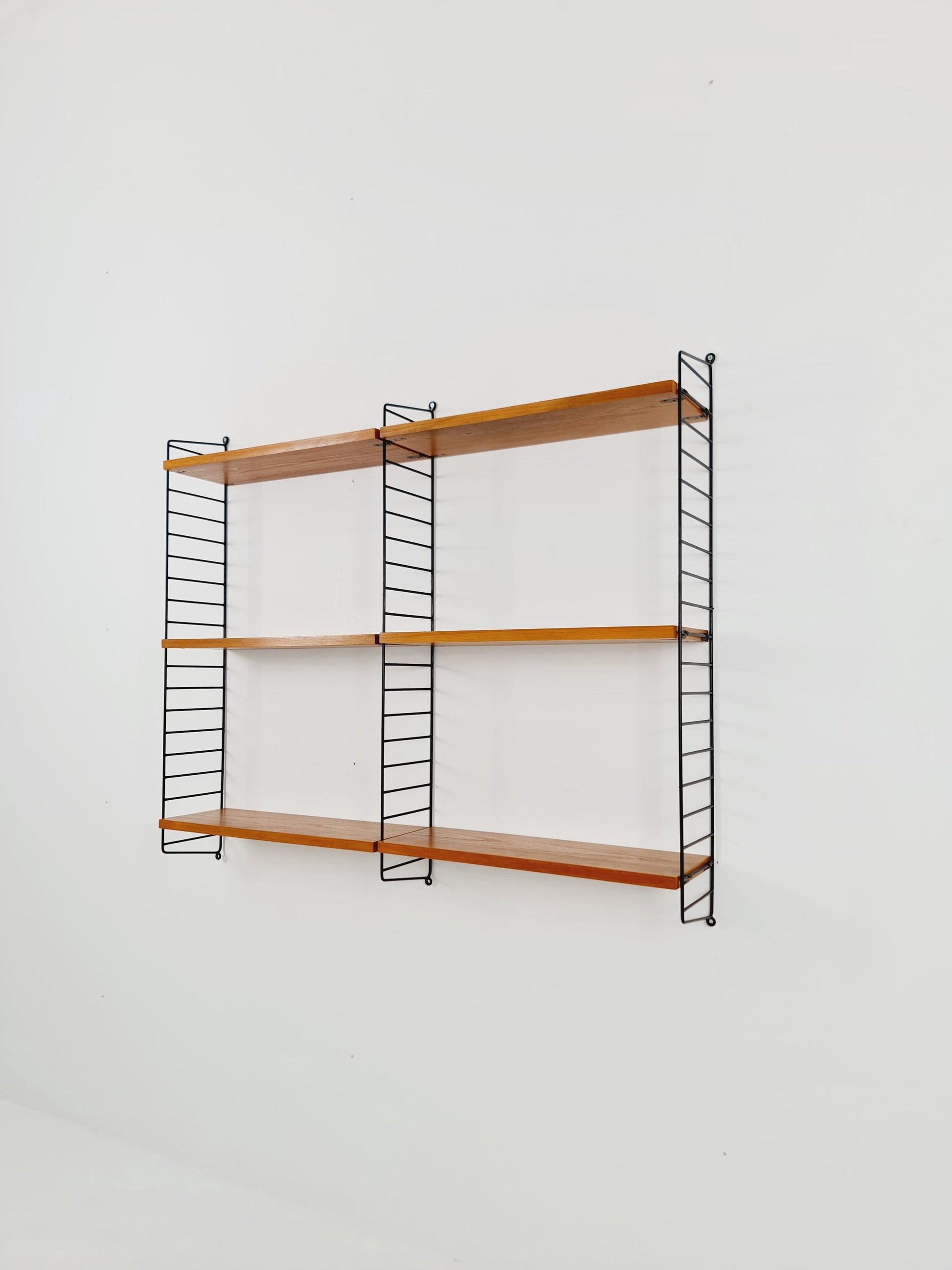 Original MCM Ash wood shelving system - consists of Black lacquered metal ladders, from string Stockholm 1960s