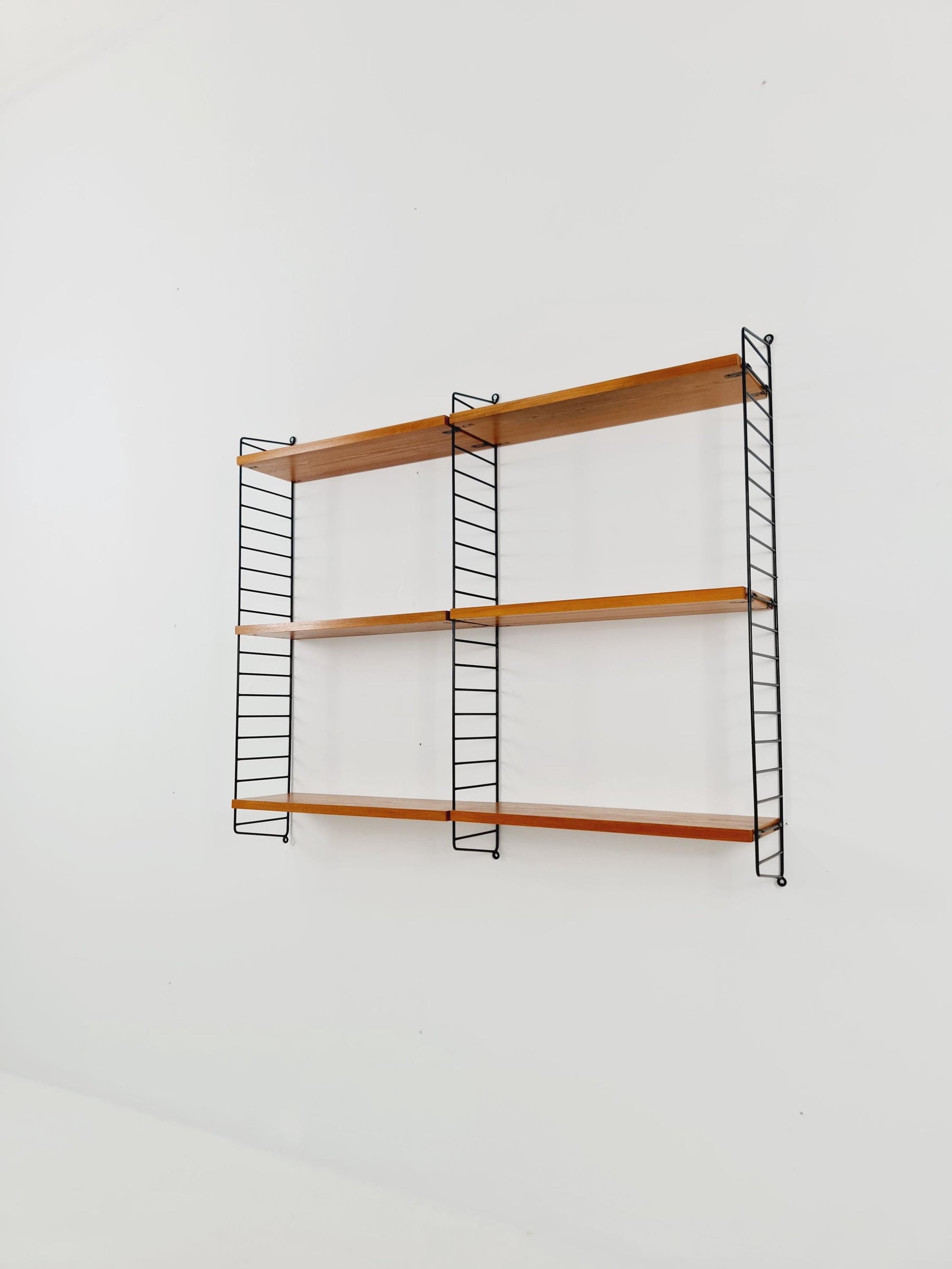 Original MCM Ash wood shelving system - consists of Black lacquered metal ladders, from string Stockholm 1960s