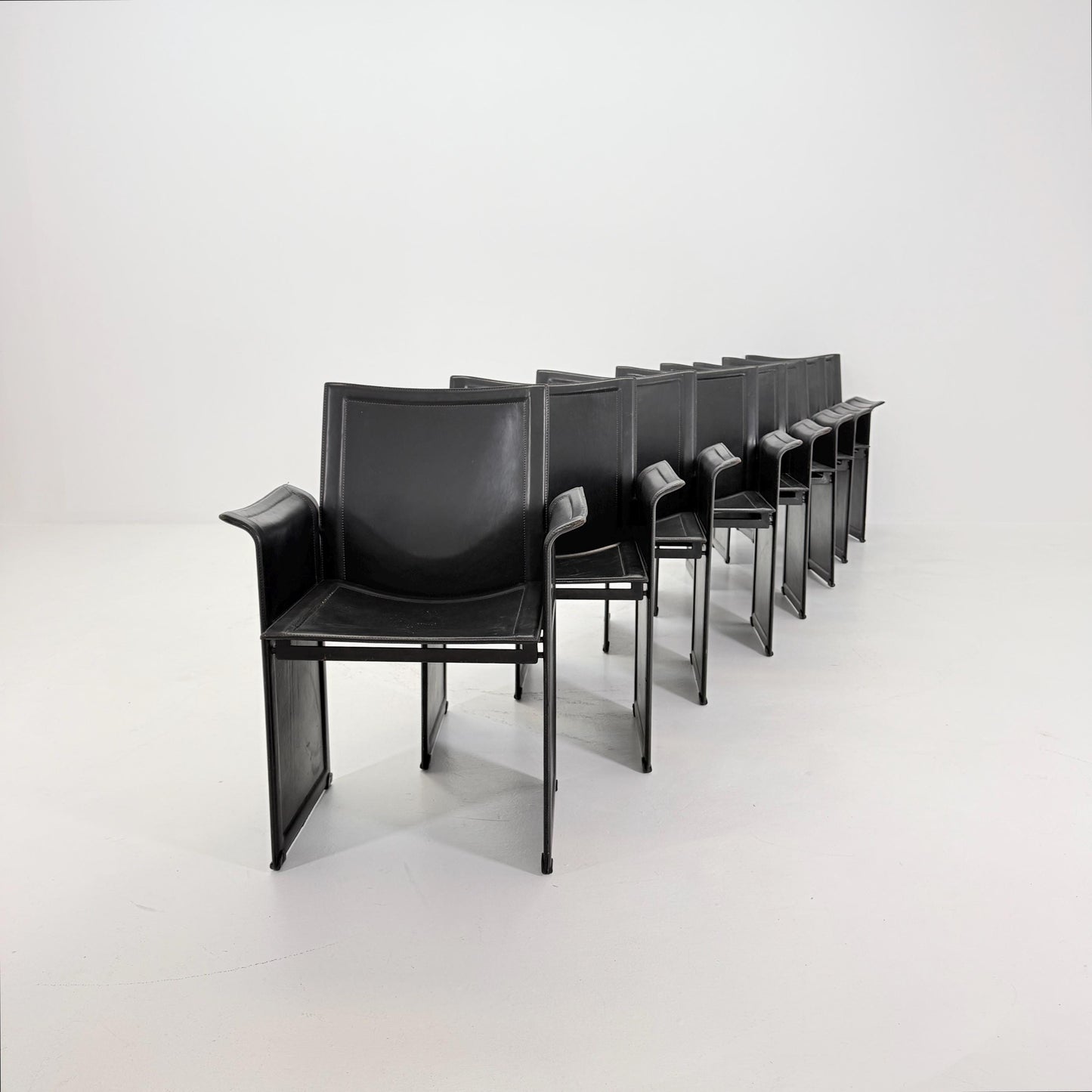 Set of 8 Mid-Century Italian “Korium” KM1 Black Leather Armchair by Tito Agnoli for Matteo Grassi, 1970s Italy
