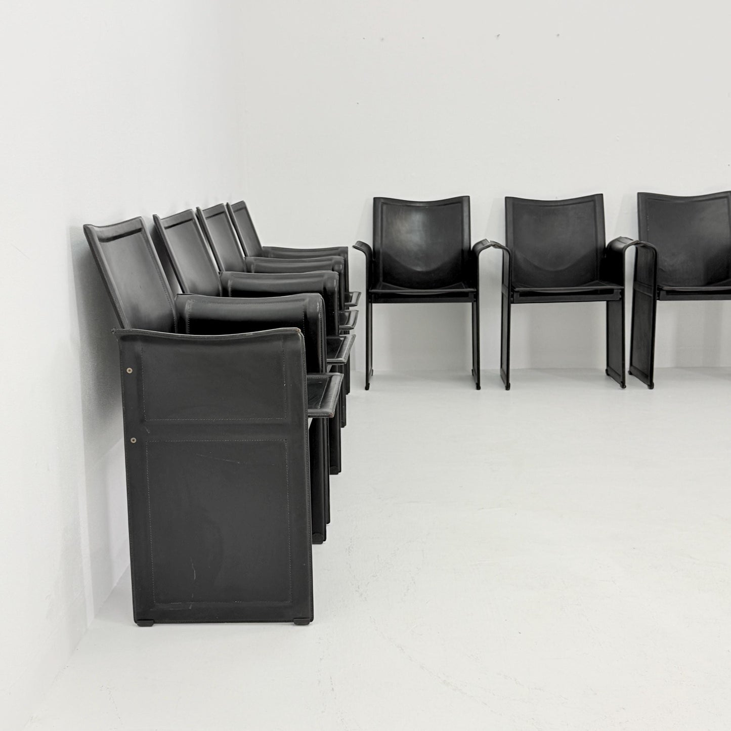 Set of 8 Mid-Century Italian “Korium” KM1 Black Leather Armchair by Tito Agnoli for Matteo Grassi, 1970s Italy
