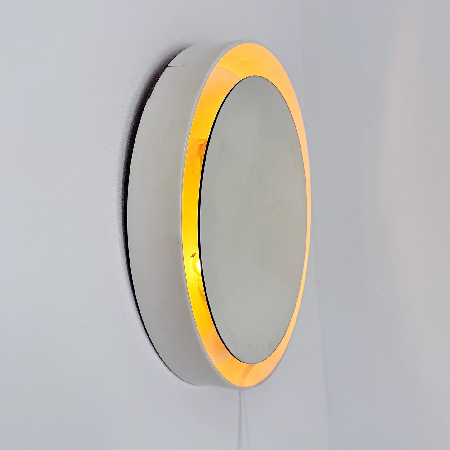 Mid century vintage wall illuminated mirror backlit with a cream plastic frame Sweden 1970s