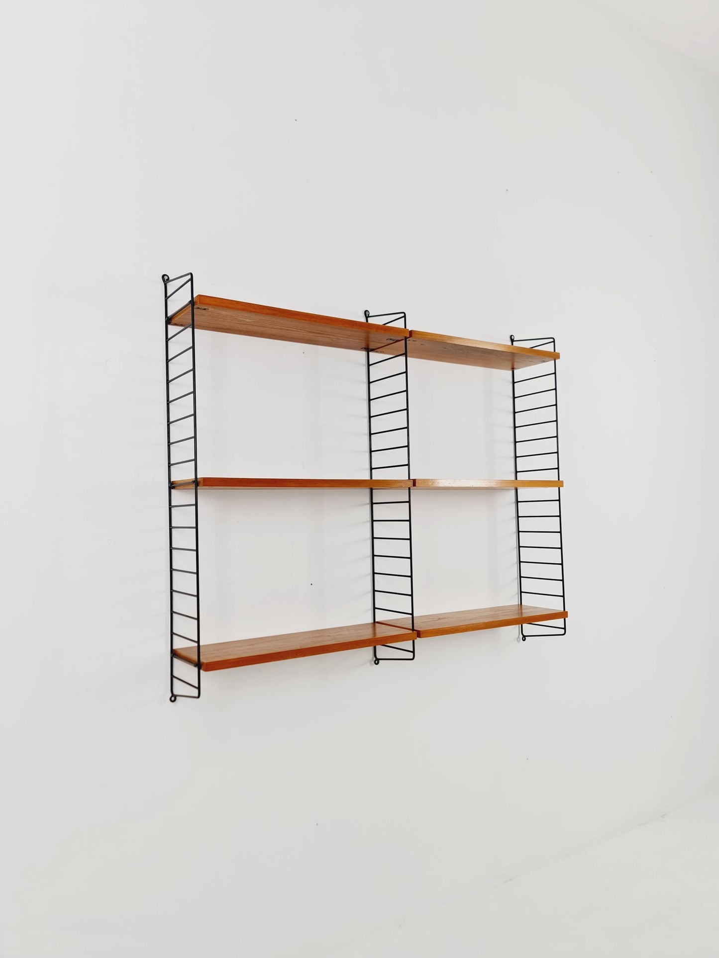 Original MCM Ash wood shelving system - consists of Black lacquered metal ladders, from string Stockholm 1960s