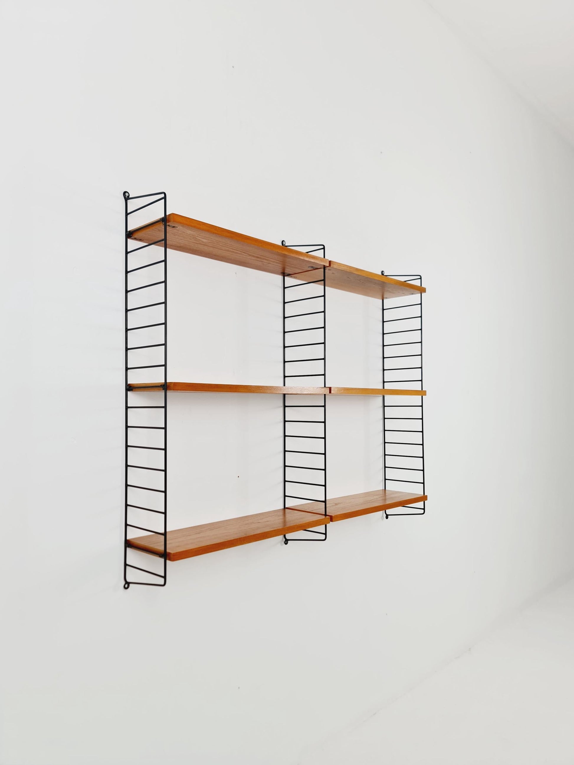 Original MCM Ash wood shelving system - consists of Black lacquered metal ladders, from string Stockholm 1960s