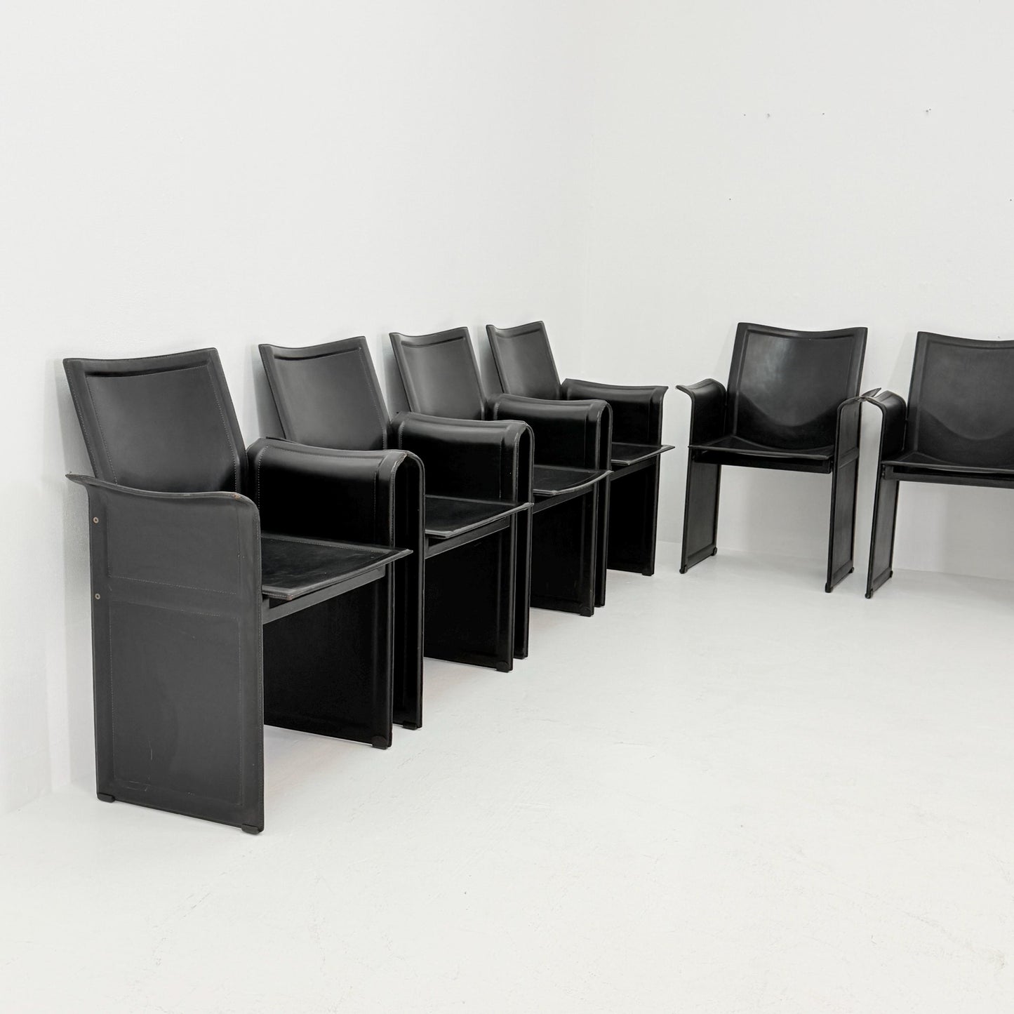 Set of 8 Mid-Century Italian “Korium” KM1 Black Leather Armchair by Tito Agnoli for Matteo Grassi, 1970s Italy