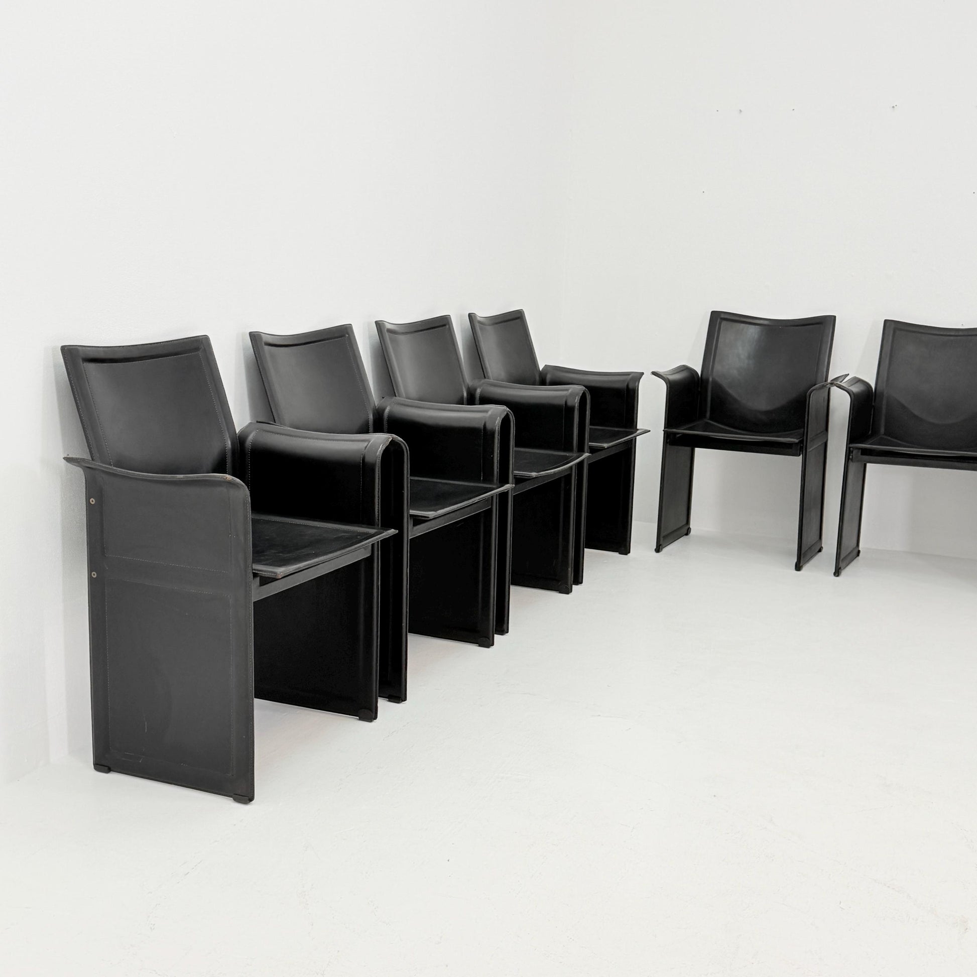 Set of 8 Mid-Century Italian “Korium” KM1 Black Leather Armchair by Tito Agnoli for Matteo Grassi, 1970s Italy