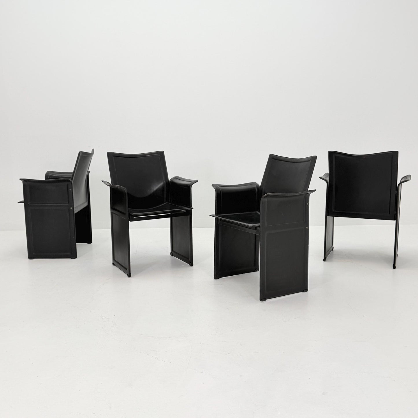 Set of 8 Mid-Century Italian “Korium” KM1 Black Leather Armchair by Tito Agnoli for Matteo Grassi, 1970s Italy