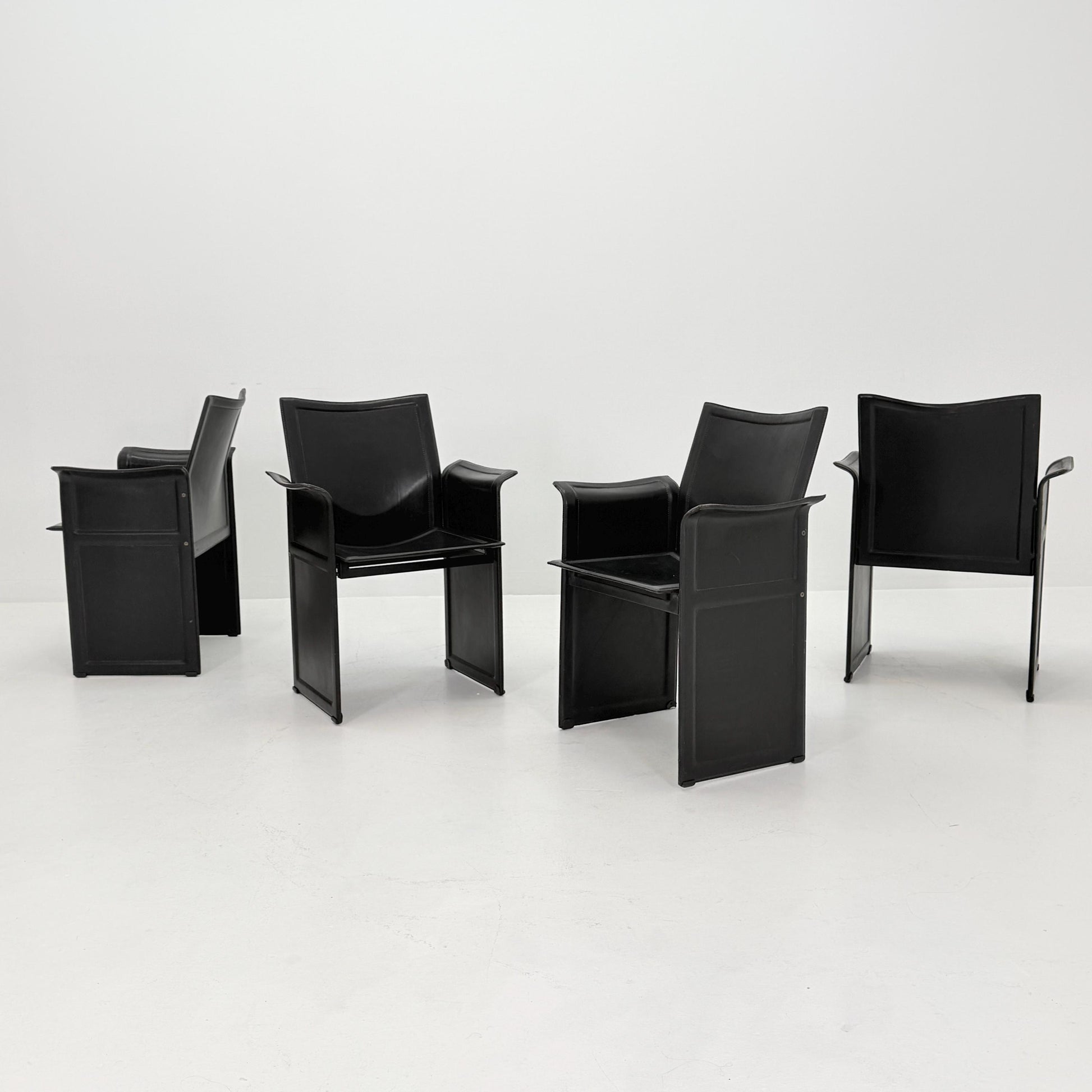 Set of 8 Mid-Century Italian “Korium” KM1 Black Leather Armchair by Tito Agnoli for Matteo Grassi, 1970s Italy