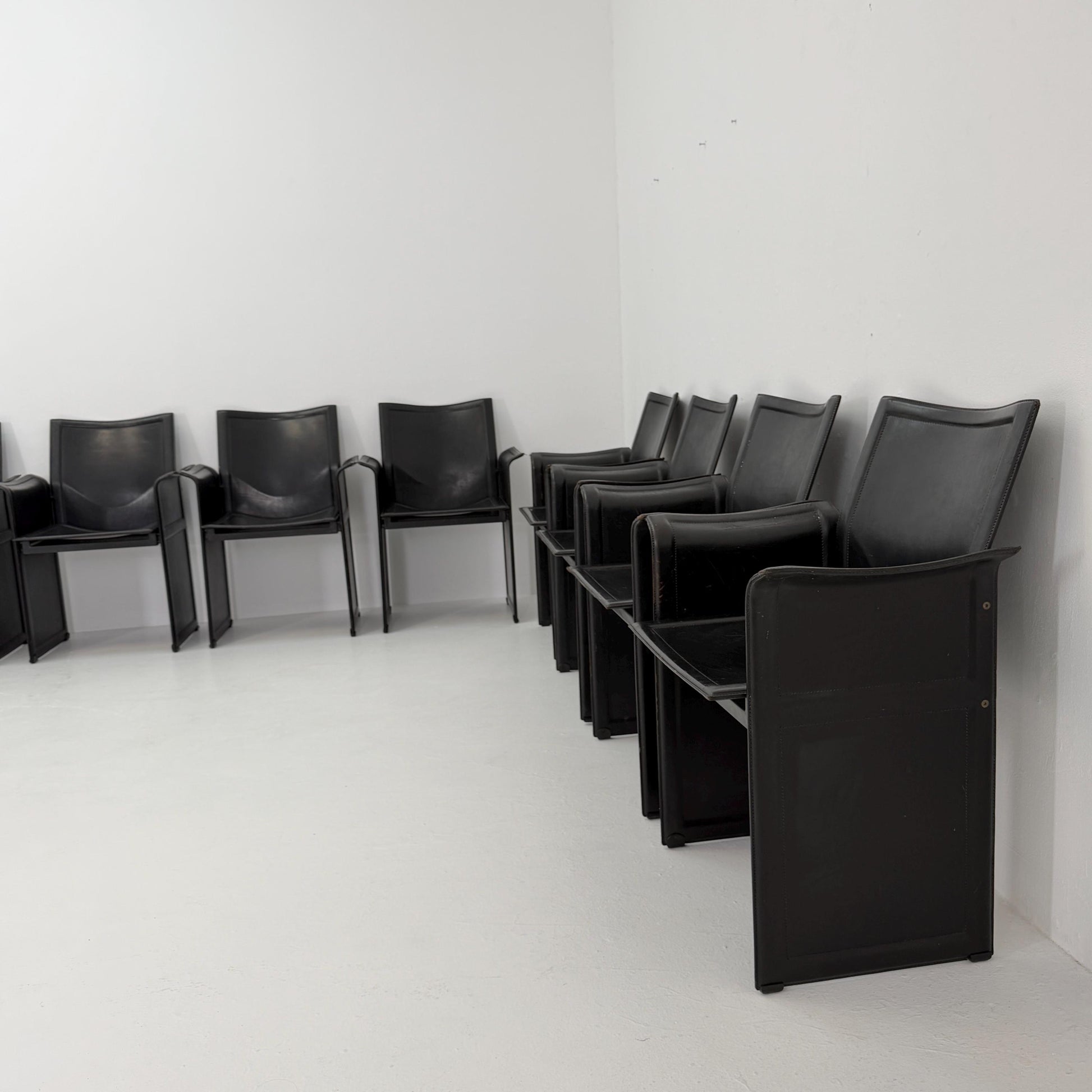 Set of 8 Mid-Century Italian “Korium” KM1 Black Leather Armchair by Tito Agnoli for Matteo Grassi, 1970s Italy