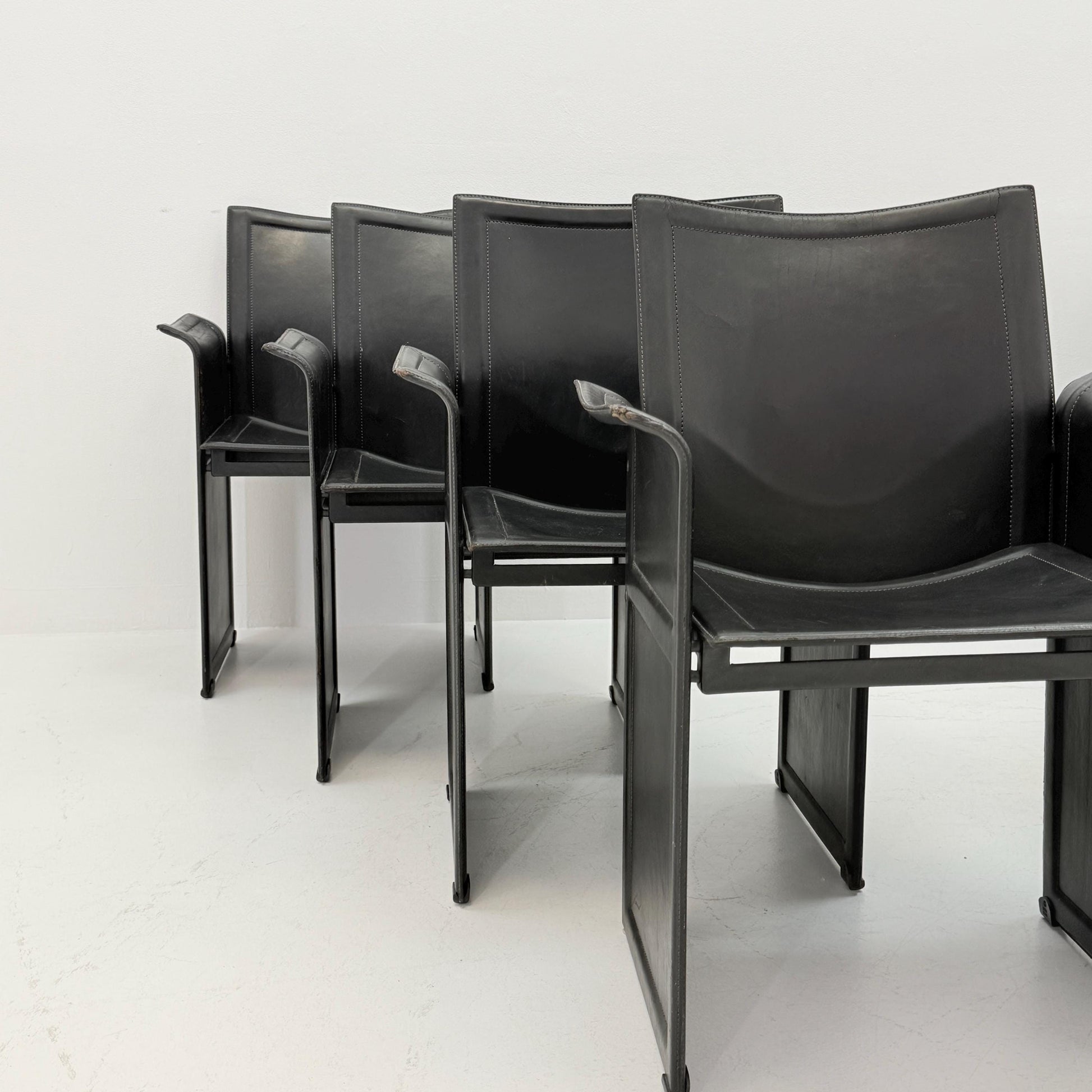 Set of 8 Mid-Century Italian “Korium” KM1 Black Leather Armchair by Tito Agnoli for Matteo Grassi, 1970s Italy