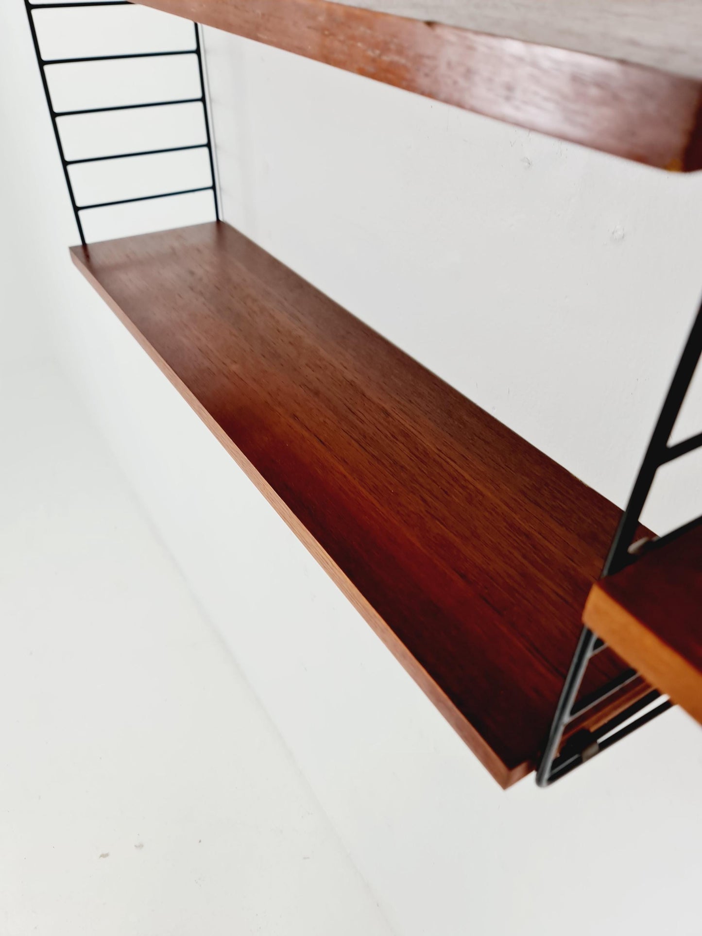 Original MCM Teak shelving system - consists of black lacquered metal ladders, from string Stockholm 1960s